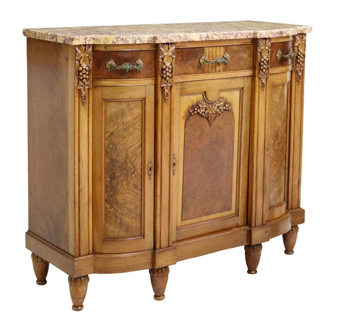 FRENCH ART DECO MARBLE-TOP WALNUT SERVER: French Art Deco marble-top walnut server, c.1930s, carved grape clusters, three drawers, over three cabinet doors, rising on tapered legs, approx 42.5"h, 48.75"w, 20.5"d Start Price: $400.00