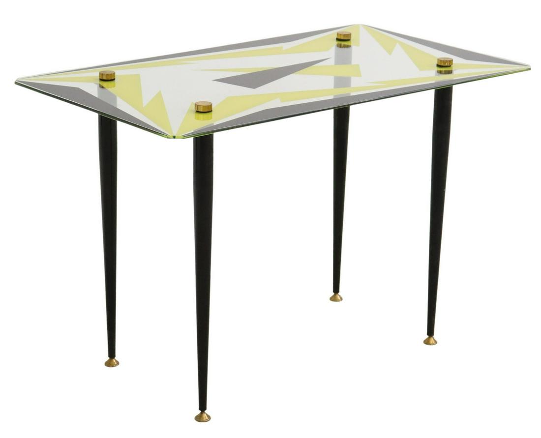 MODERN GEOMETRIC GLASS & METAL COFFEE TABLE: Modern design glass and metal coffee table, c.1960s-1970s, having colorless glass top, with applied geometric vinyl motifs to underside, rising on tapered tubular steel supports, ending on brass cap f