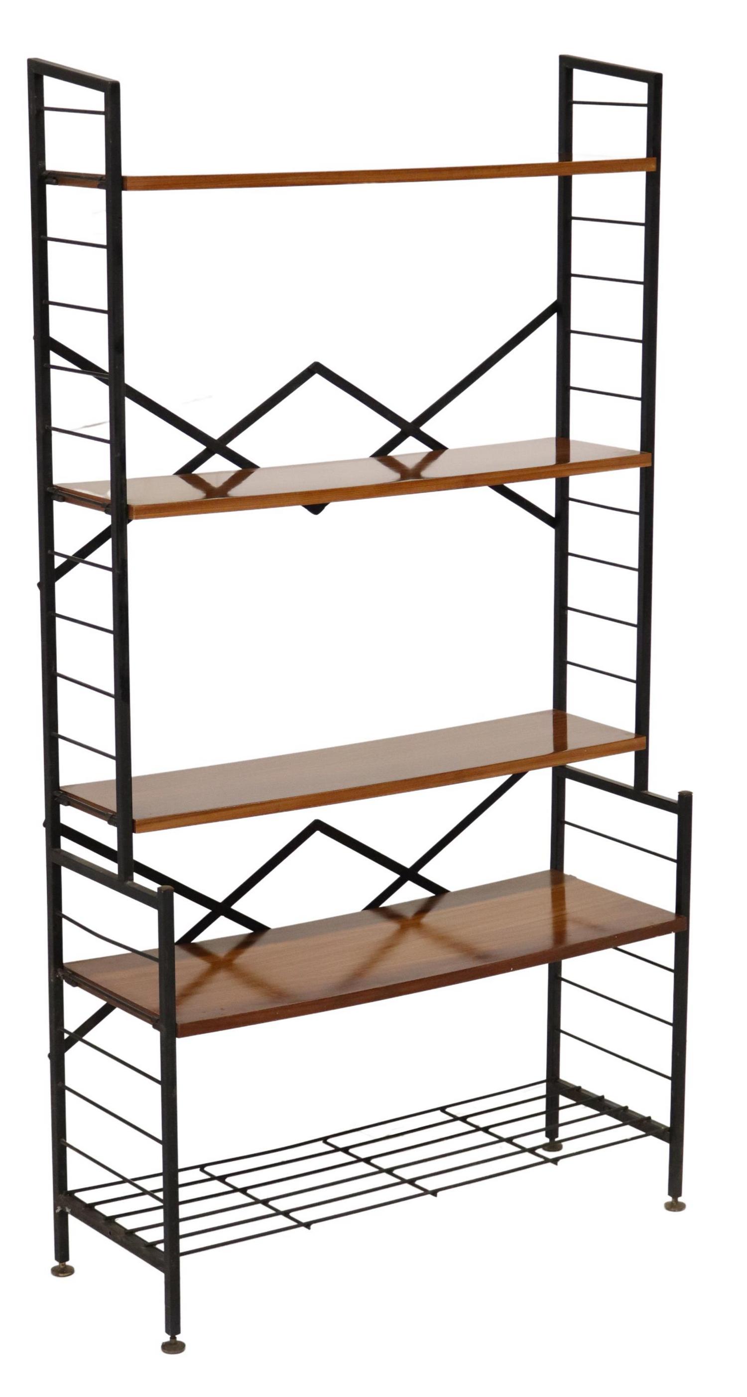 ITALIAN MID-CENTURY MODERN TEAK & STEEL BOOKCASE: Italian mid-century modern teak bookcase, c.1960s, having four teak shelves, protruding lower case, rising on steel supports, approx 59.5"h, 32"w, 11.5"d Start Price: $150.00