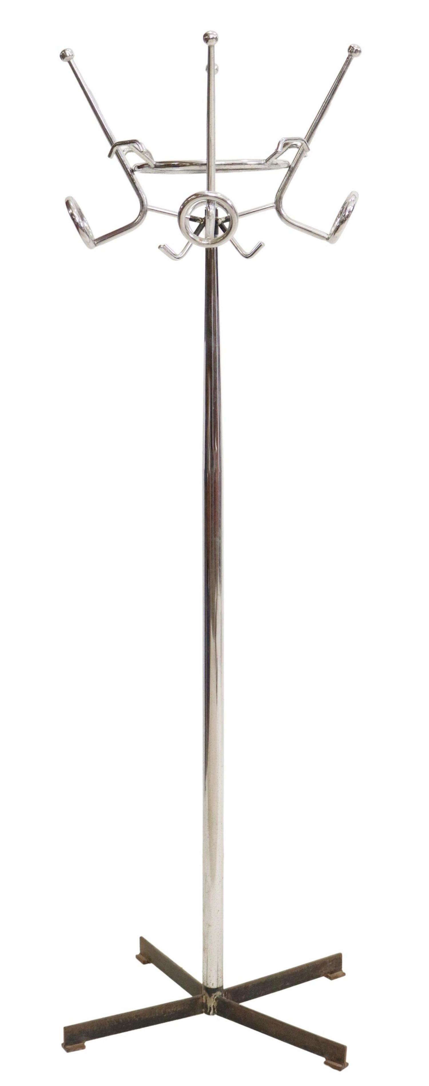 ITALIAN MODERN CHROMED STEEL HALL TREE/ COAT RACK: Italian modern chromed steel hall tree, 20th c., top ring issuing twelve total hooks, rising on tapered cylindrical standard, ending on black X-form base, approx 74"h, 25.25"diam Start Price: $150.00