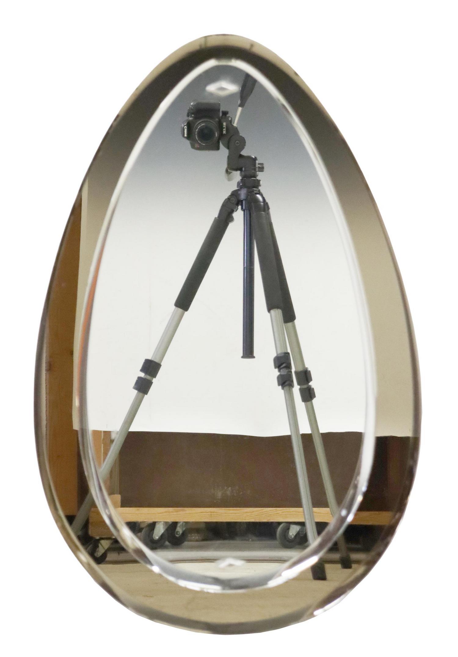 ITALIAN MODERN MURANO GLASS MIRROR: Italian modern Murano glass mirror, c.1970s, teardrop form, beveled mirror plate, on beveled smoke glass frame, approx 31"h, 19.75"w, 14.1lbs Start Price: $100.00