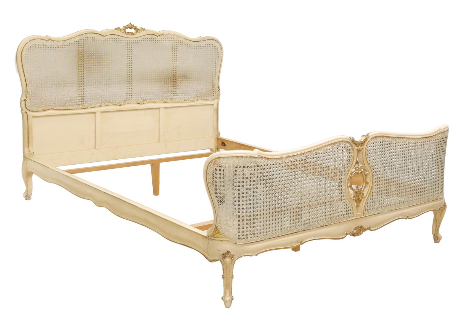 FRENCH LOUIS XV STYLE PARCEL GILT & PAINTED BED: French Louis XV style parcel gilt and painted bed, 20th c., single cane headboard, double cane footboard, rising on cabriole legs, exterior: approx 43.25"h, 80.5"l, 61"w, interior: approx 74"l, 56"w S