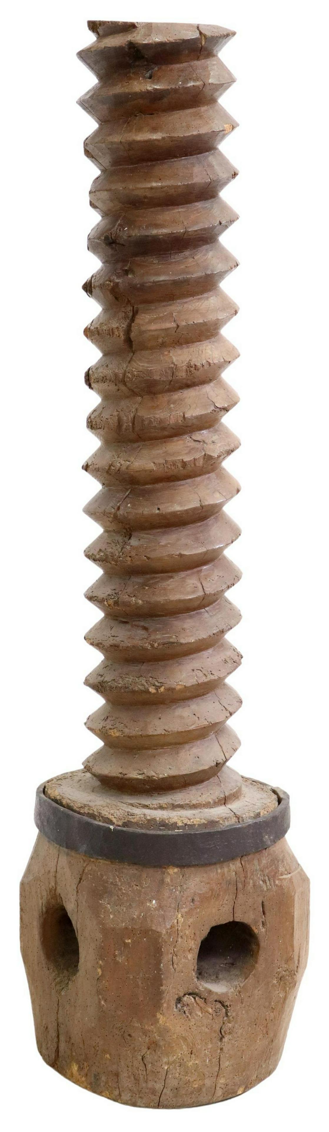 ARCHITECTURAL GRAPE PRESS SCREW STAND: Architectural wood grape press screw, 19th c., having lower iron band, rising on block base, approx 54"h, 13.5"sq Start Price: $150.00