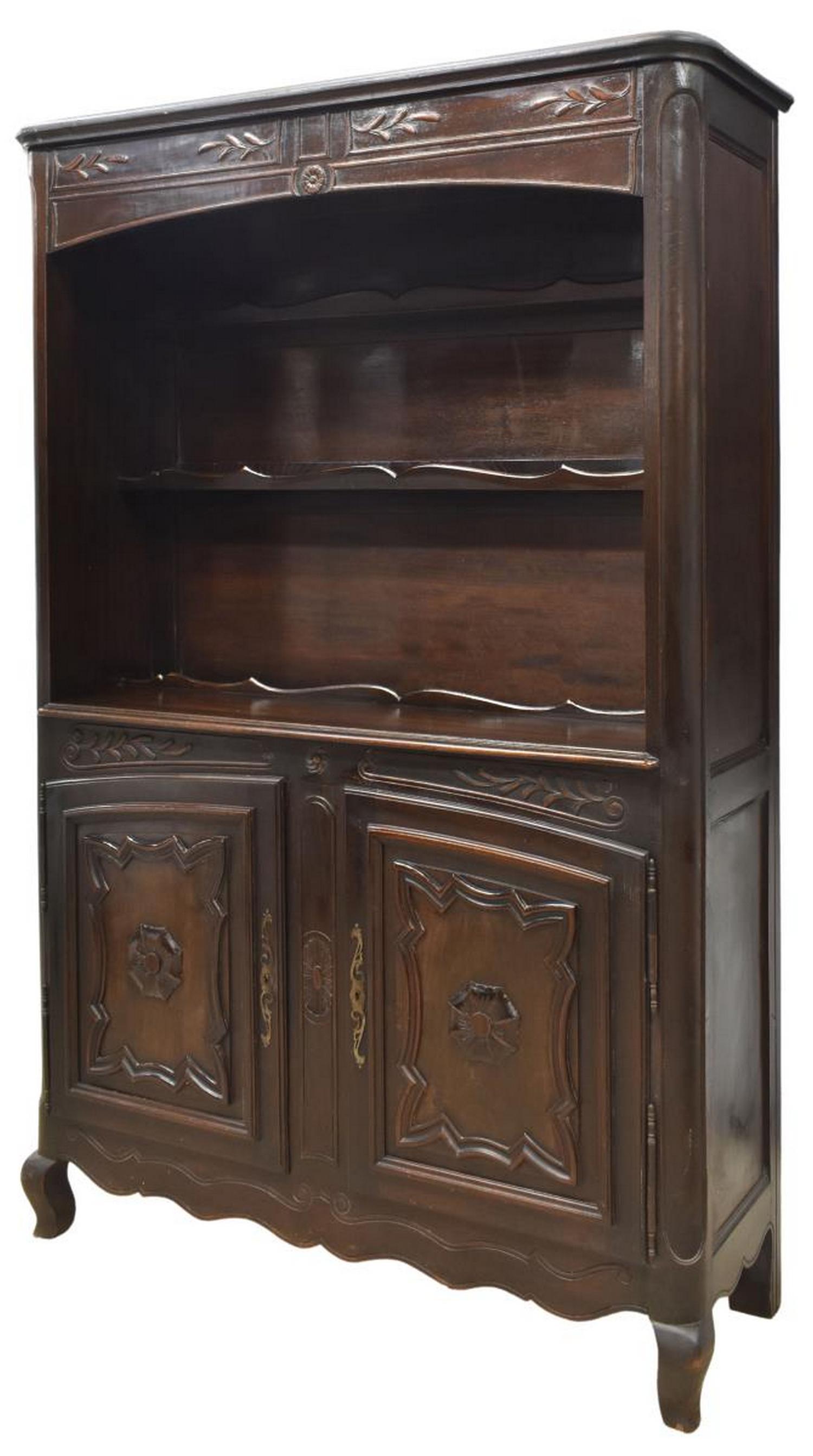 FRENCH PROVINCIAL LOUIS XV STYLE OAK VAISSELIER: French Provincial Louis XV style oak vaisselier/ kitchen dresser, early 20th c., foliate carved frieze, open shelves with scalloped plate rails, lower case fitted with paneled double-door cabinet, on 