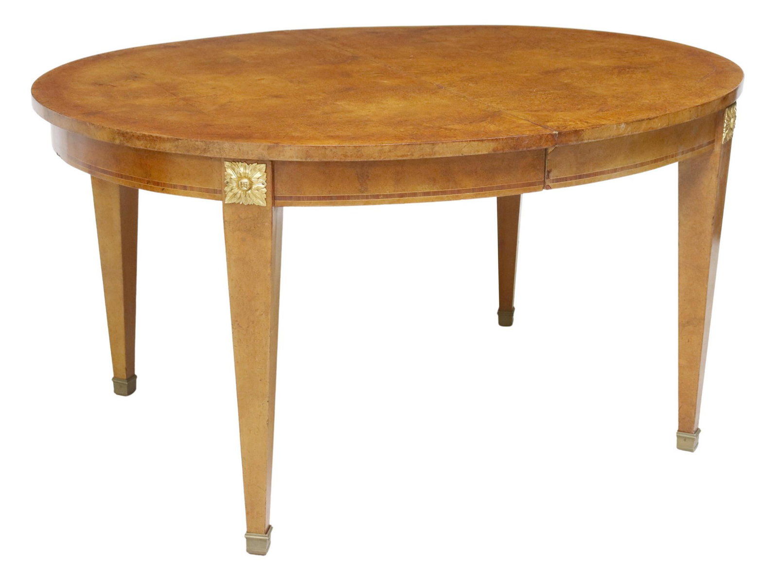 FRENCH BURLWOOD EXTENSION DINING TABLE: French burlwood dining table, late 19th c., oval tabletop, banded apron with gilt metal foliate bosses, rising on tapering square legs, ending in sabots, scratches to tabletop, veneer losses at apron,