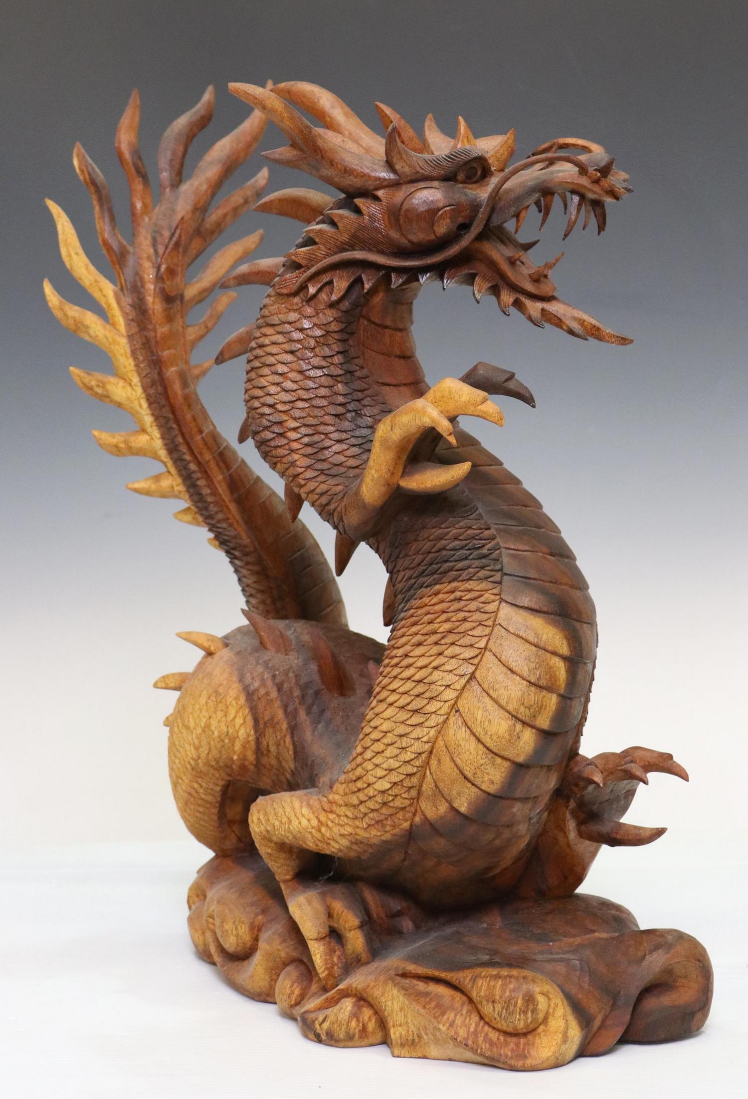 ASIAN CARVED WOOD FIGURAL DRAGON SCULPTURE: Asian carved wood figural dragon sculpture, depicting a standing dragon in dynamic pose, with open mouth, on integral naturalistic base, some small losses and restorations, approx 22"h, 16"w, 8"d, 12.