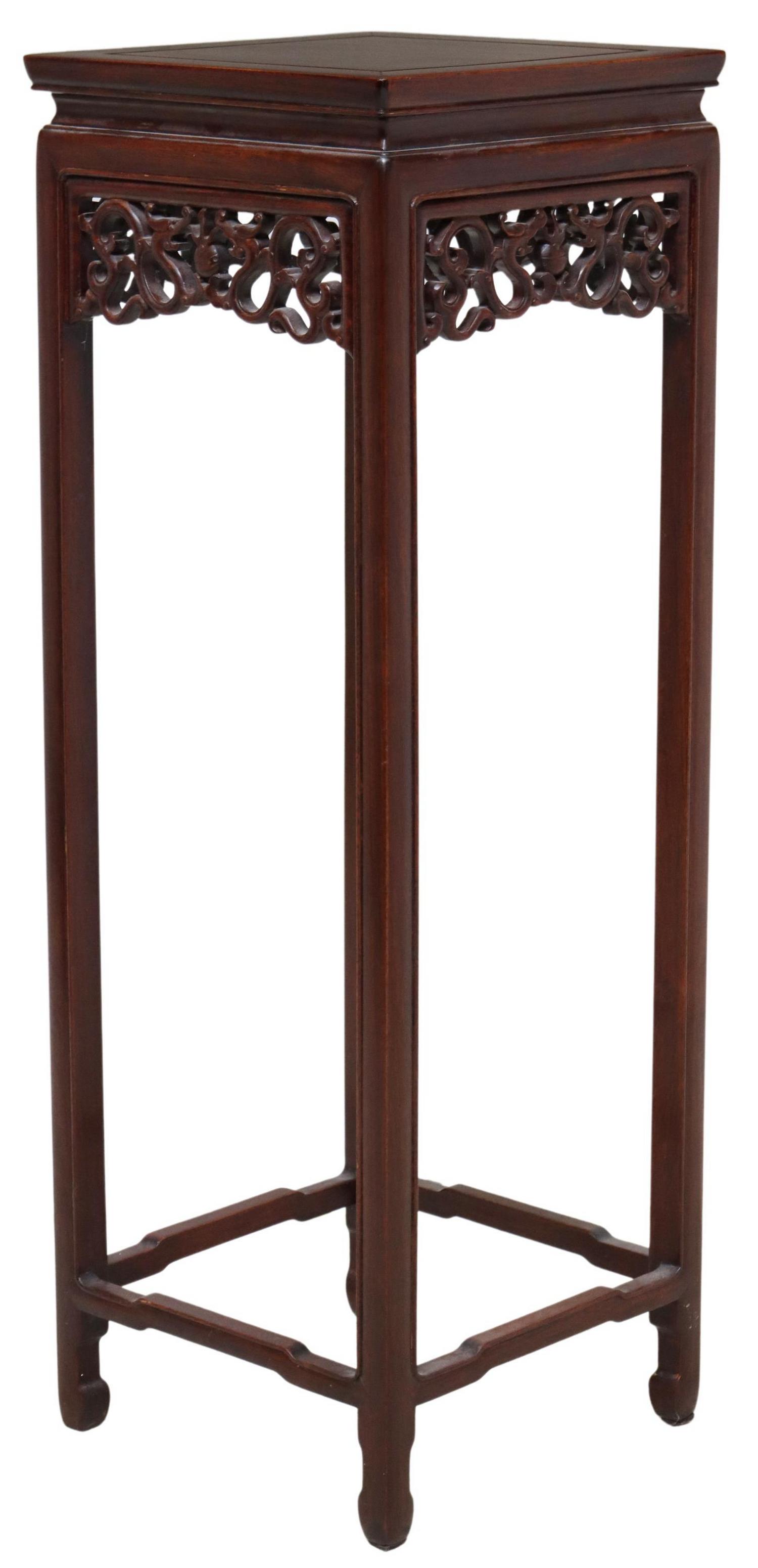 CHINESE CARVED MAHOGANY PLANT STAND PEDESTAL: Chinese mahogany stand/ pedestal, having squared top, openwork apron with dragons, rising on stretcher-joined block legs, ending in hoof feet, approx 36"h, 12.5"w, 12.5"d Start Price: $60.00