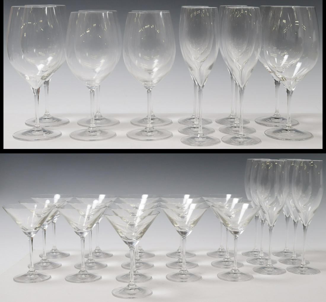 (36) RIEDEL STEMWARE, MARTINI, WINE, CHAMPAGNE: (lot of 36) Riedel glass stemware, assorted, in varying sizes, including: (8) wine glasses, (four) larger, (four) smaller, approx 9.5"h, 3"diam; (12) champagne flutes, approx 9.25"h, 3"diam; (16) mart