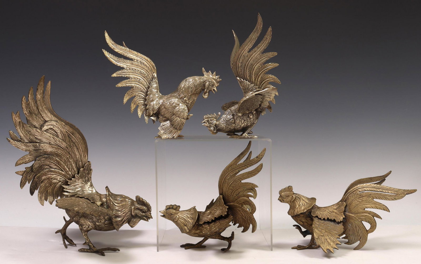 (5) CONTINENTAL SILVERED BRONZE FIGHTING ROOSTERS: (lot of 5) Continental silvered bronze fighting roosters, various poses and sizes, (one) not standing upright independently, largest: approx 10.5"h, 10"w, 8"d; 7.25lbs total Start Price: $150.00