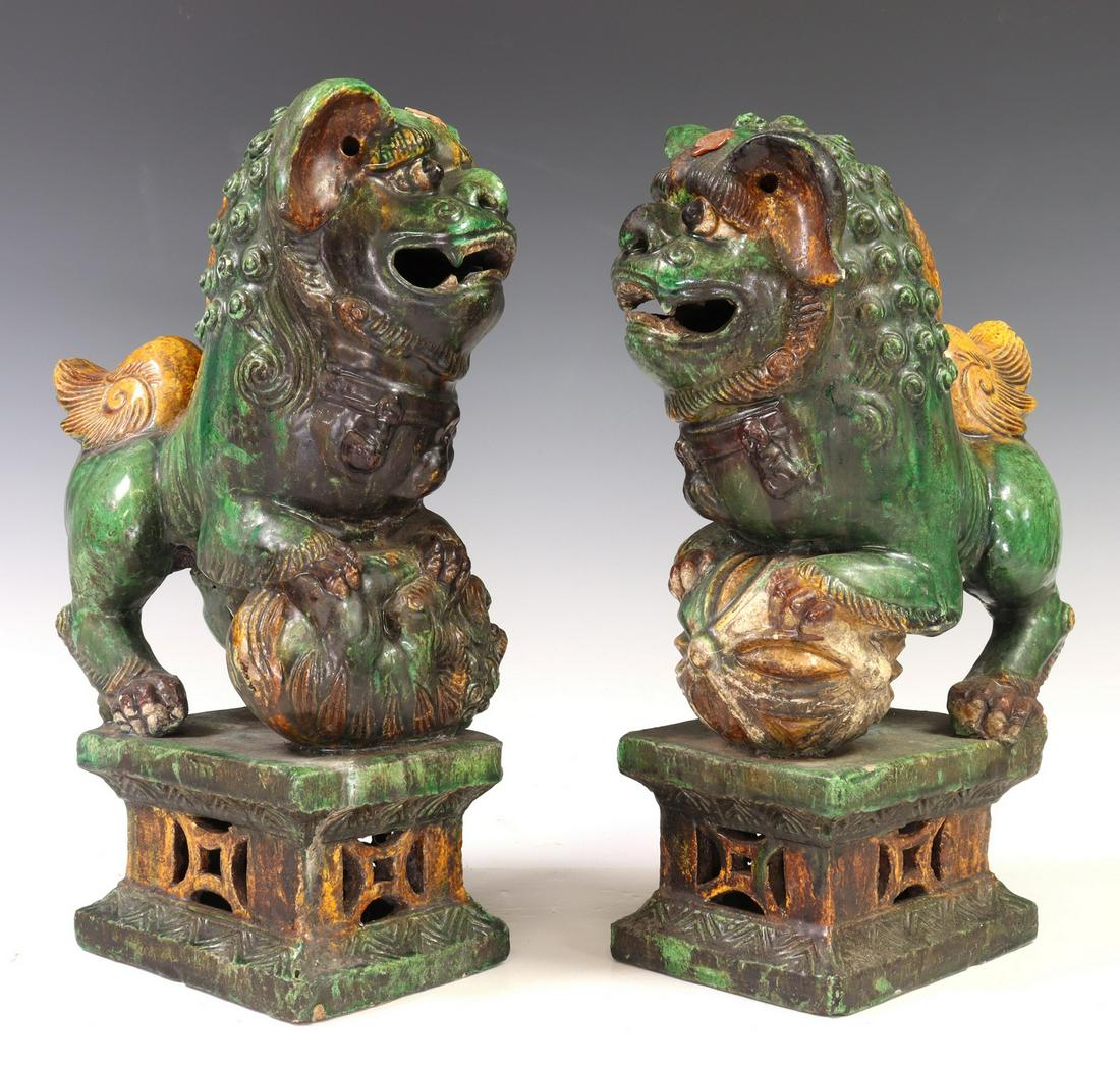 (2) CHINESE SANCAI GLAZED FOO LION INCENSE HOLDERS: (lot of 2) Chinese Sancai glazed incense holders, each in the form of a standing foo lion, on pierced rectangular base, with partial red wax seal at forehead, (one) having internal figure, (one) with 