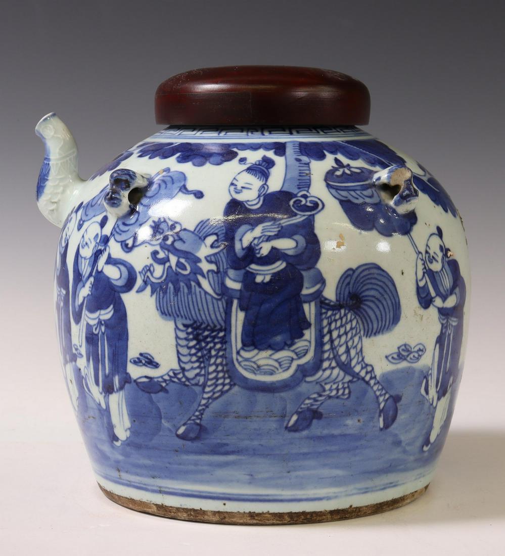 CHINESE BLUE & WHITE PORCELAIN LIDDED WINE JAR: Chinese blue and white porcelain wine jar/ ewer, having later wood cover, over arched spout, four figural animal head handles, painted procession scene at front face, visible chip to one handle and sp