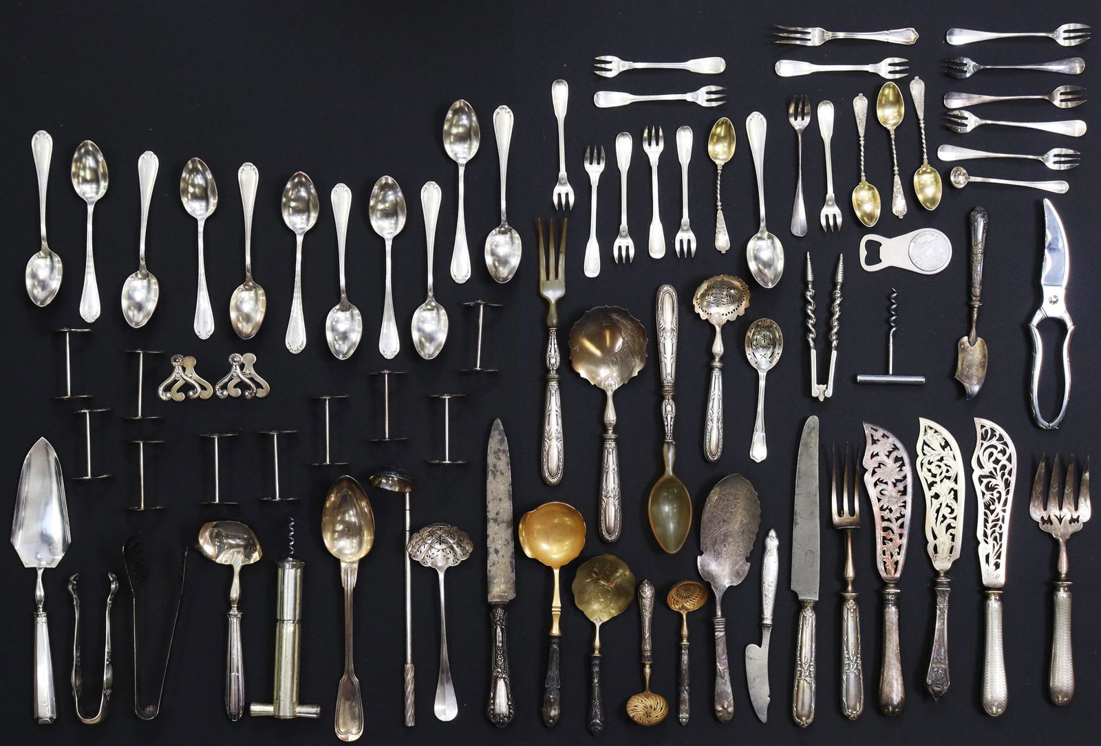 (LOT) FRENCH SILVERPLATE & SILVER-HANDLED FLATWARE: (lot) Assembled silver-handled, silverplate, and other metal flatware, including: knife rests, fish serving sets, pierced bowl spoons, carving knives, corkscrews, tongs, cocktail/ seafood forks, etc.,