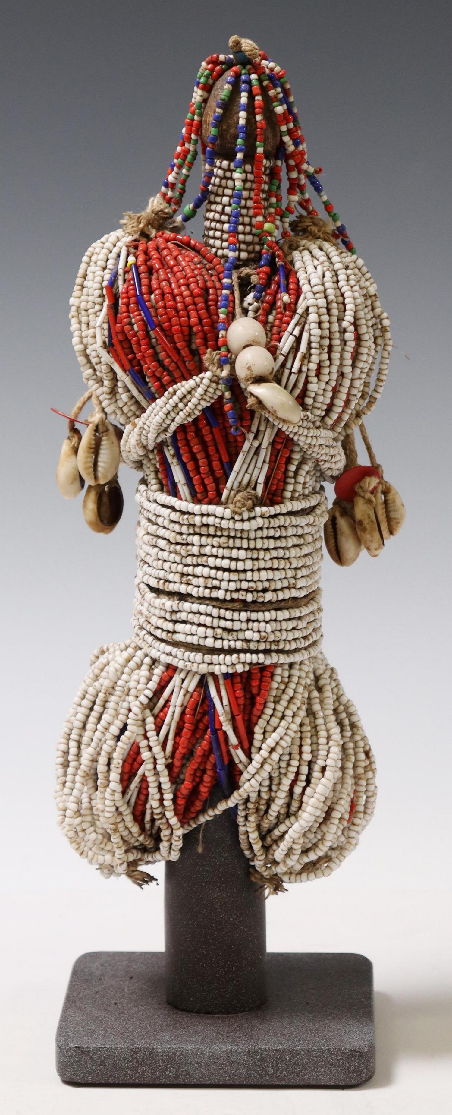 AFRICAN FALI BEADED FERTILITY DOLL ON CUSTOM STAND: African carved and beaded fertility doll, the Fali peoples, Cameroon, on custom metal display stand, approx 13"h, 4"w, 4"d, 5lbs total **Provenance: purchased at Lotus Gallery, Austin, Texas****Proven