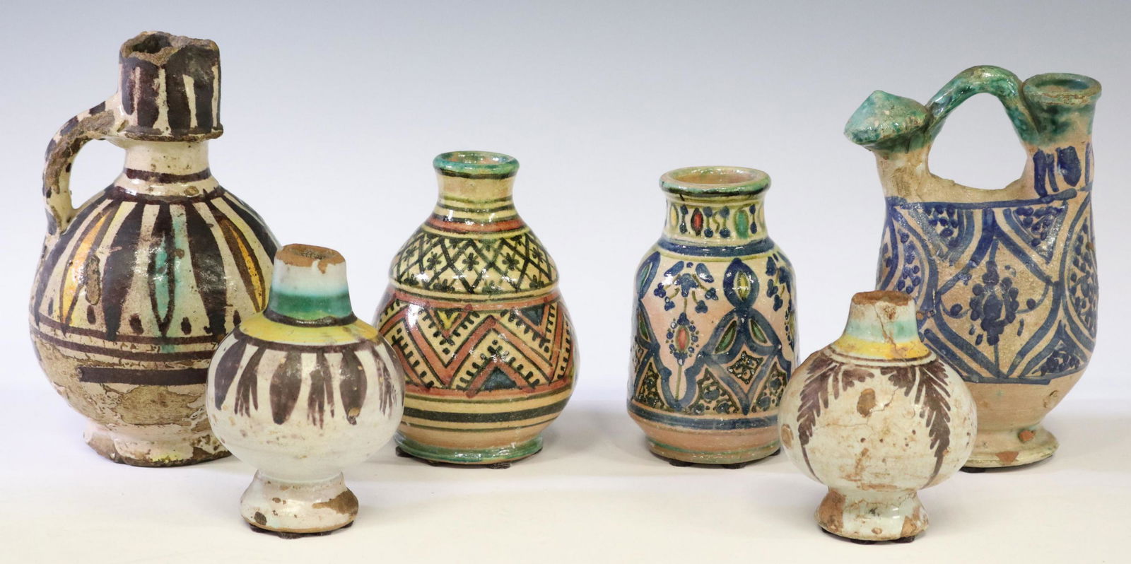 (6) MOROCCAN GLAZED POTTERY VESSELS: (lot of 6) Glazed earthenware pottery vessels, likely from Morocco, highlights include: (2) small vases, marked for the Lamali Workshop, (2) ewers/ flasks, largest: approx 6.25"h; typical small chips,