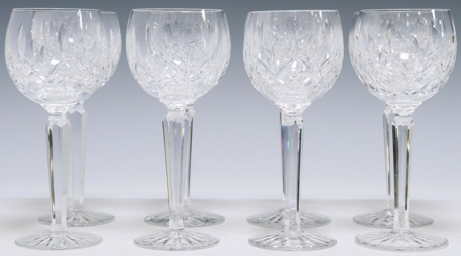 8) WATERFORD LISMORE CUT CRYSTAL HOCK WINE GLASSES: (lot of 8) Waterford cut crystal hock wine glasses, in the "Lismore" pattern, bowl with vertical cuts, multi-sided stem, acid-etched mark underfoot, approx 7 3/8"h, 3"diam; 6.5lbs total Start Price: $