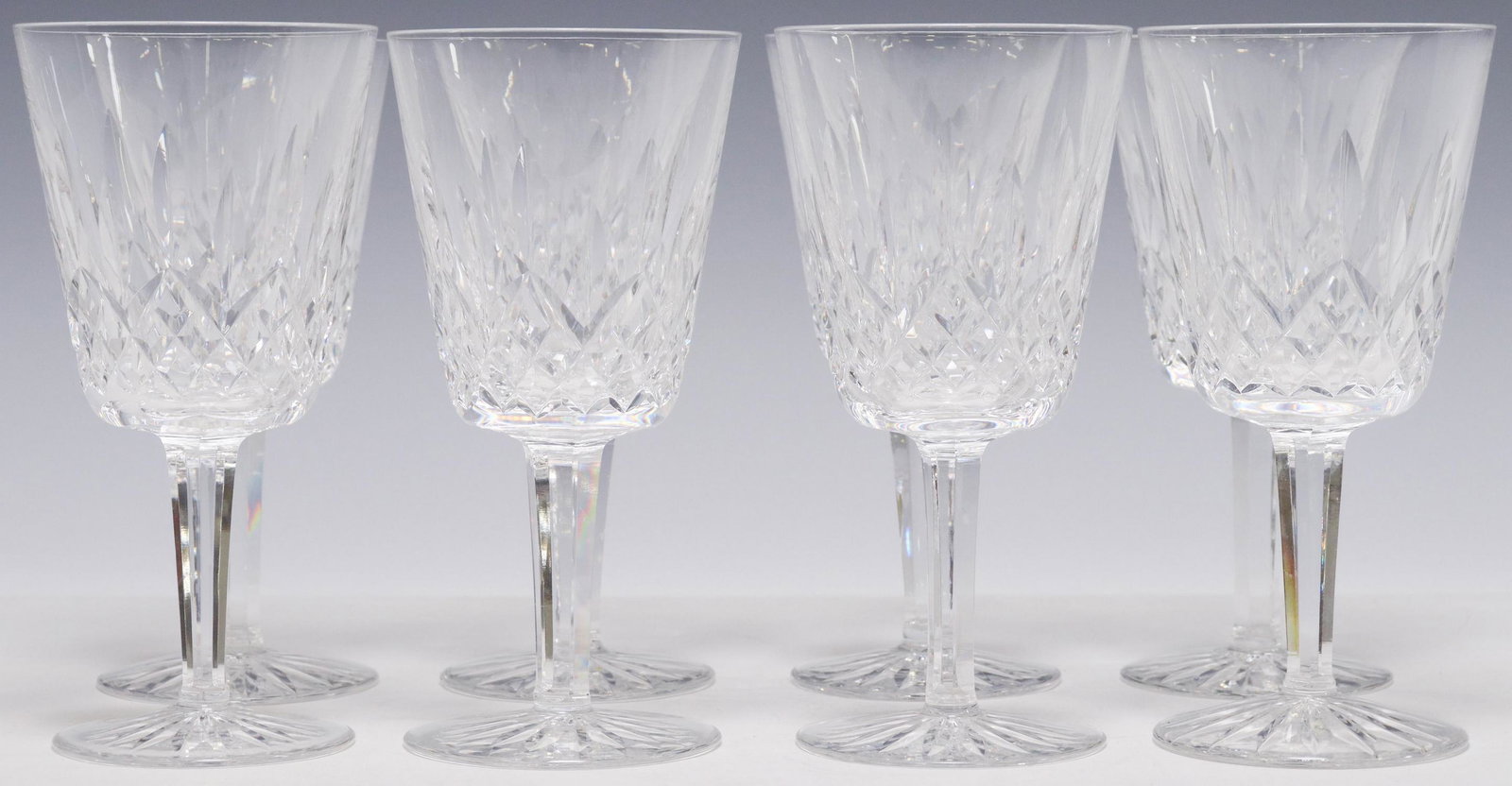 (8) WATERFORD LISMORE CUT CRYSTAL WATER GOBLETS: (lot of 8) Waterford cut crystal water goblets, in the "Lismore" pattern, bowl with vertical cuts, multi-sided stem, acid-etched mark underfoot, approx 6 7/8"h, 3 3/8"diam; 7.5lbs total Start Price: $