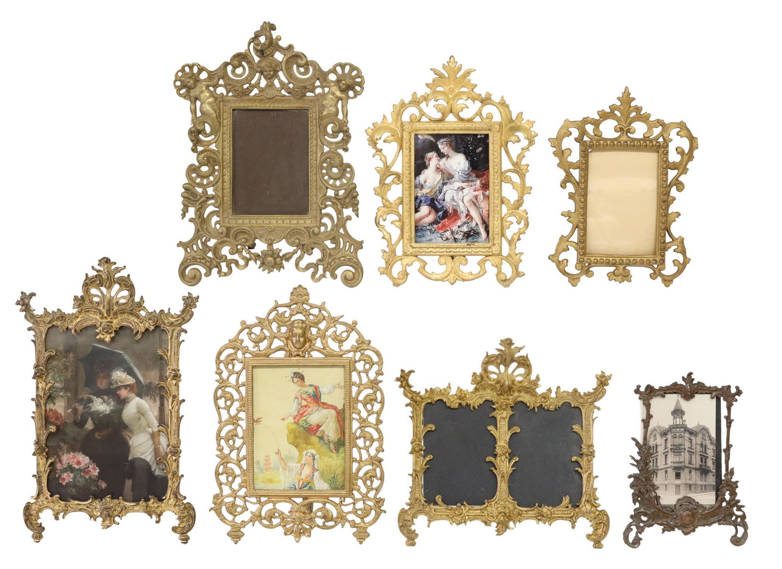 (7) GILT & PATINATED METAL SCROLLED PICTURE FRAMES: (lot of 7) Gilt and patinated metal picture frames, each with raised scroll and foliate motifs, largest: approx 16"h, 9.5"w, 12lbs total Start Price: $80.00