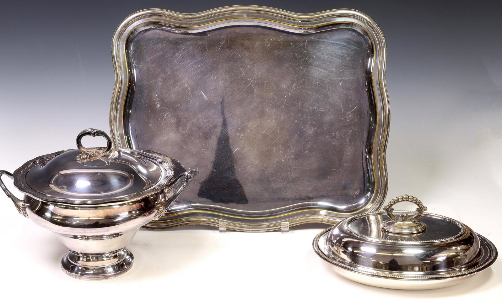 (3) SILVERPLATE TUREENS & SERVING TRAY: (lot of 3) Silverplate tableware, including: (1) English Barker Brothers vegetable tureen, approx 5.25"h, 11.25"l, 8.5"w, (1) Polish Bros. Buch serving tray, surface scratches, approx 19"l, 15.5"w, (1