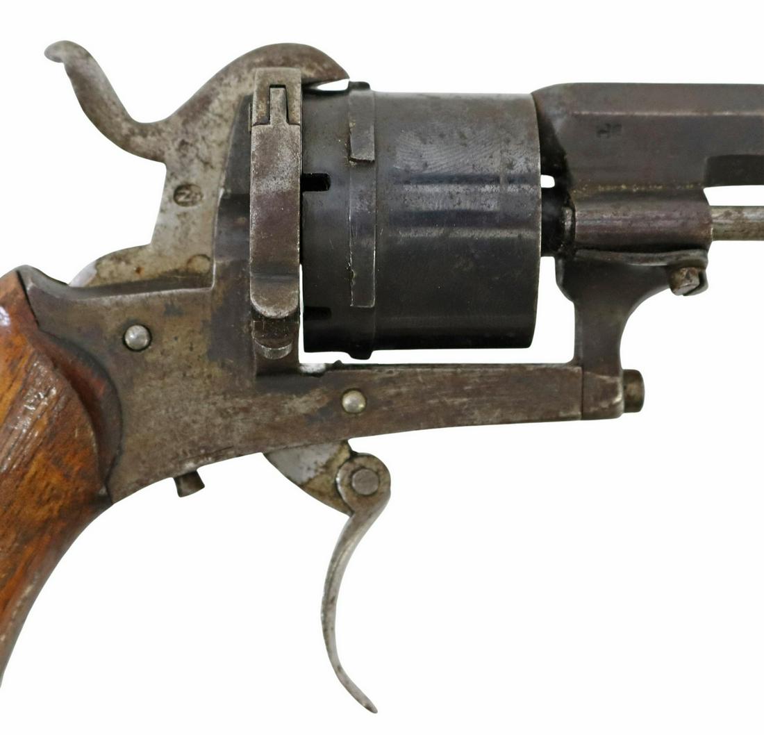 ANTIQUE BELGIUM PINFIFRE REVOLVER: French pin fire revolver, estimated 28 caliber, 3.5" octagonal barrel with inspection mark at cylinder end, six round cylinder with Liege ELG star mark, folding trigger, wood grips, marked at left und