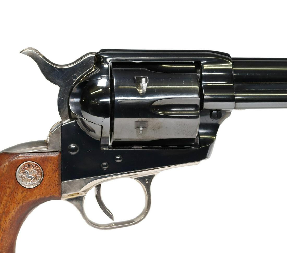 COLT SAA 125TH ANNIV. REVOLVER, .45 CAL. 2ND GEN: Colt Revolver marked at the barrel "125th Anniversary-S.A.A. Model, Mfg. 1961, .45 Cal-", 7.5" barrel, six round cylinder, Colt logo wood grips, hammer, trigger guard and trigger and ejector handle wi