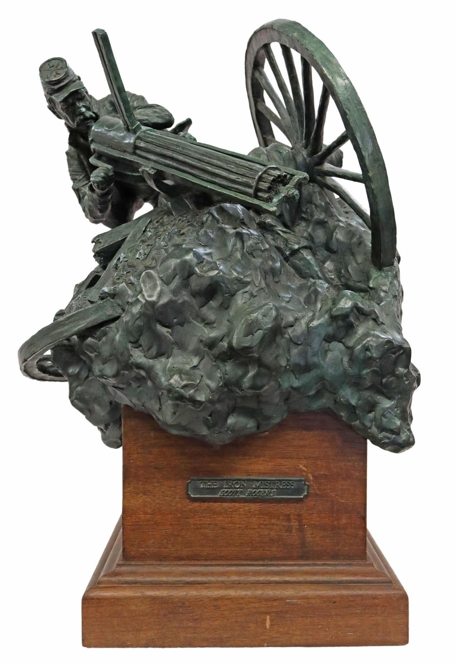 SCOTT ROGERS (B.1961) MILITARY BRONZE SCULPTURE: Patinated bronze sculpture, "The Iron Mistress," signed in cast D.S. Rogers (Scott Rogers, American, b.1960/61), numbered 5/ 30, dated [19]94, on a rotating wood plinth, overall: approx 21"h, 13.5"w, 