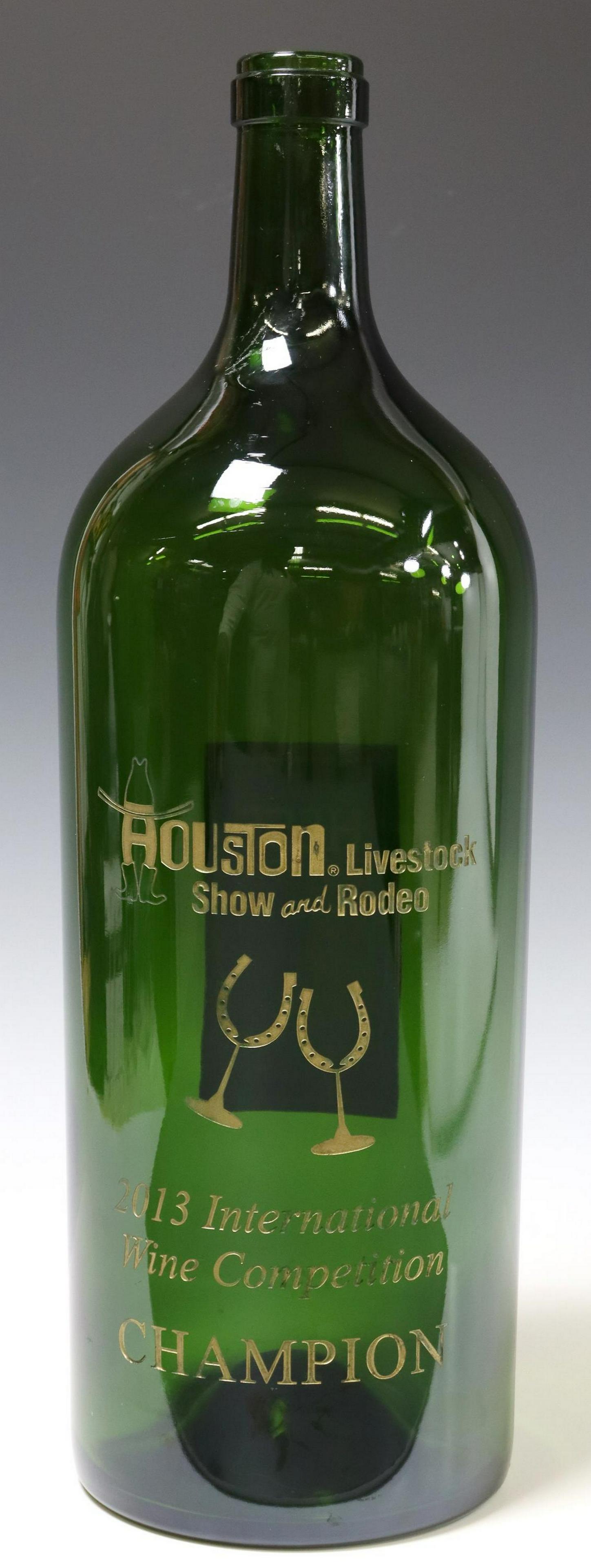 2013 HOUSTON RODEO WINE COMPETITION TROPHY BOTTLE: Houston Livestock Show and Rodeo International Wine Competition champion trophy wine bottle, 2013, green glass bottle, with champion wine label to back, Hess Collection, Allomi cabernet sauvignon, 201
