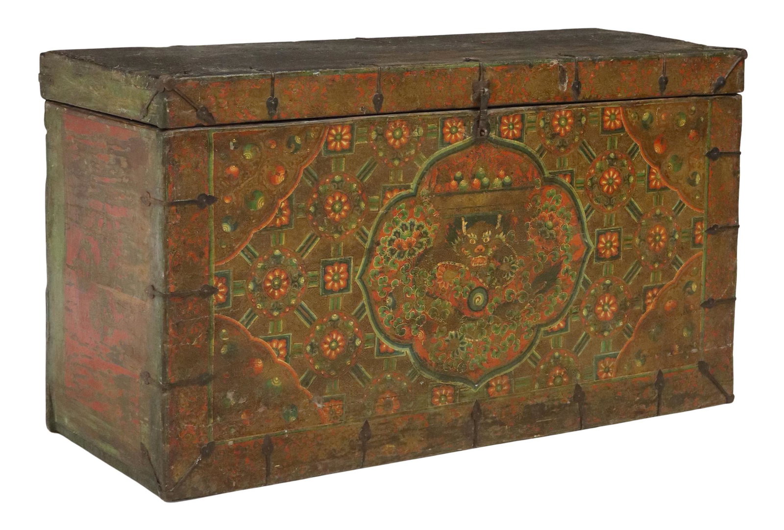 TIBETAN POLYCHROME PAINTED STORAGE COFFER: Tibetan polychrome painted coffer/ storage chest, central cartouche depicting dragon with fruit bowl offering, amongst repeating lattice pattern motifs, iron hardware, approx 24.5"h, 44"w, 16.25"d Sta