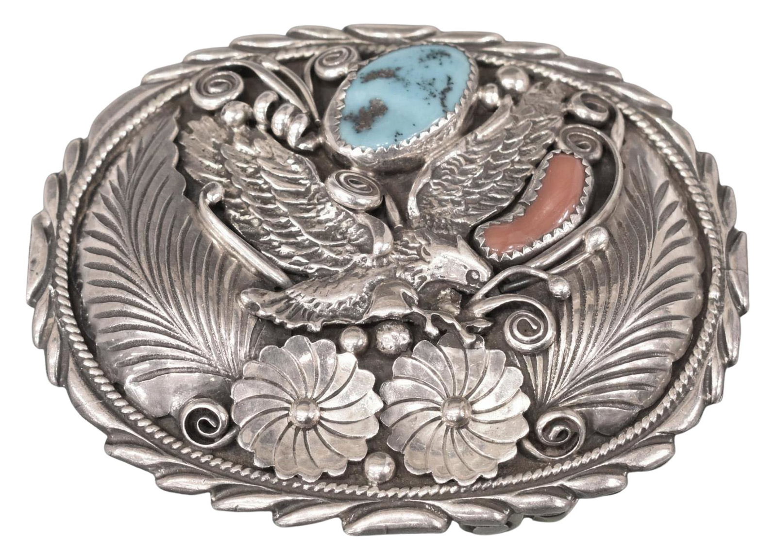 ROBERT BECENTI NAVAJO STERLING EAGLE BELT BUCKLE: Native American sterling silver belt buckle, signed RB (Robert Becenti, Navajo/ Dine, 1949-2001), finely worked oval form with spread wing eagle, feathers and flowers, fitted with a turquoise and red