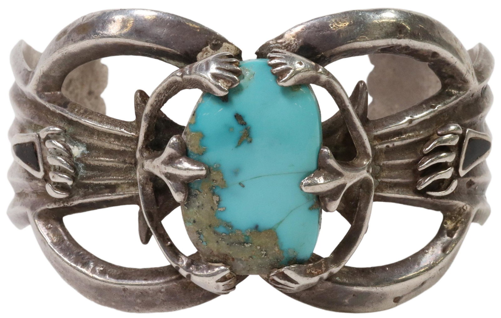 NATIVE AMERICAN TUFA CAST SILVER & TURQUOISE CUFF: Native American tufa cast silver (content unknown) cuff bracelet, central turquoise stone, sides with animal paw design, turquoise intact with faint hairlines, split at back of silver mount, approx 1.