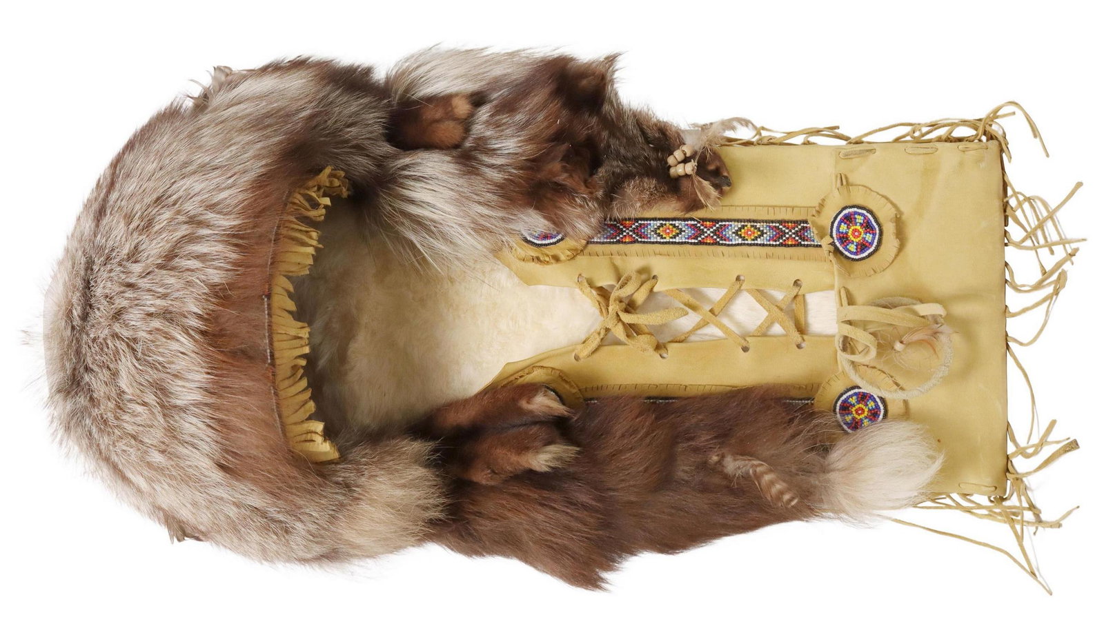 NATIVE AMERICAN STYLE BEADED FUR FRINGED CRADLE: Native American style cradle, 20th c., having fur and feather accents, beading, fringe, approx 26"h, 13"w, 8"d, 5.5lbs**Provenance: The Dr. David Beer Collection of Native American Artifacts collected