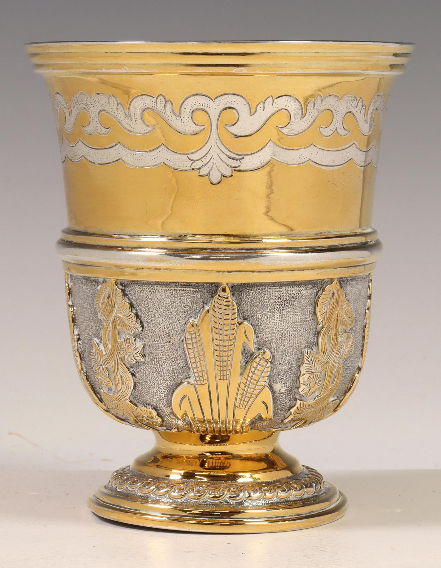 TANE ORFEBRES SILVER GILT CHALICE, MEXICO: Silver gilt chalice/ footed cup, Tane Orfebres, Mexico, with chased and relief design, hallmarked underfoot "TANE MT.OH MEXICO 0.925,some wear to gilt wash, light bend/dent to foot at one side," appro