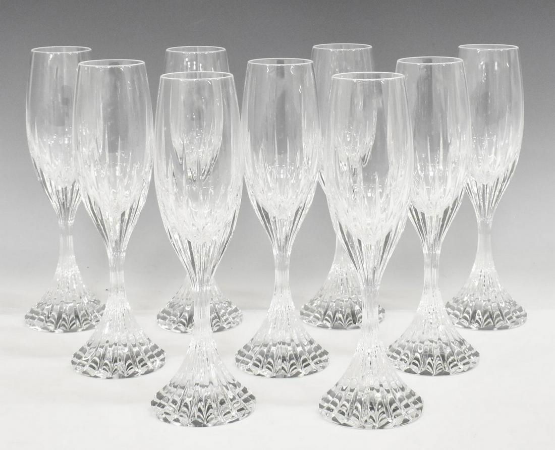 (9) BACCARAT 'MASSENA' CRYSTAL CHAMPAGNE FLUTES: (lot of 9) French Baccarat "Massena" cut crystal champagne flutes, each with vertical cuts to bowl and stem, acid-etched maker's mark underfoot, approx 8.5"h, 2 5/8"diam; 7.5lbs total Start Price: $20