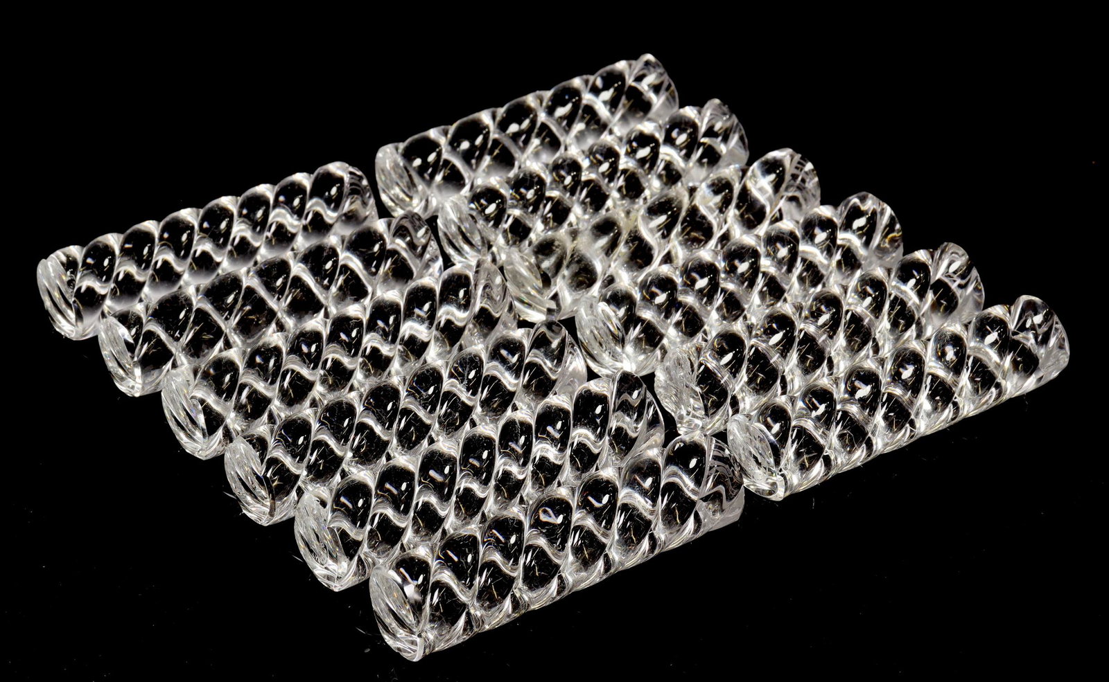 (12) FRENCH BACCARAT CRYSTAL KNIFE RESTS IN BOX: (lot of 12) French Baccarat crystal knife rests, twist design, housed in branded box, all with small chips to ends, knife rest: approx 3 1/8"l, box: approx 1"h, 10.5"l, 3.75"w, 2.25lbs total Start Pri