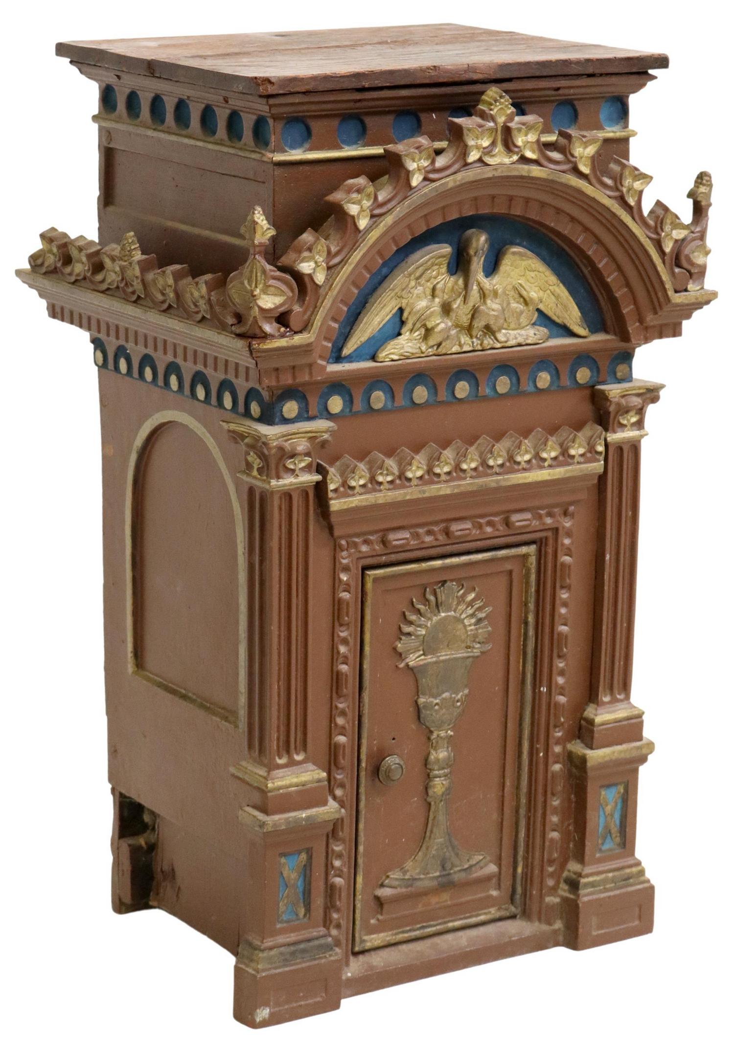 RELIGIOUS WOOD & CAST IRON MOUNTED TABERNACLE: Religious wood and cast iron mounted tabernacle, 19th c., in a polychrome painted finish, pediment with pelican, over fluted pilaster front, centering door with chalice, wood loss, approx 29 7/8"h, 17