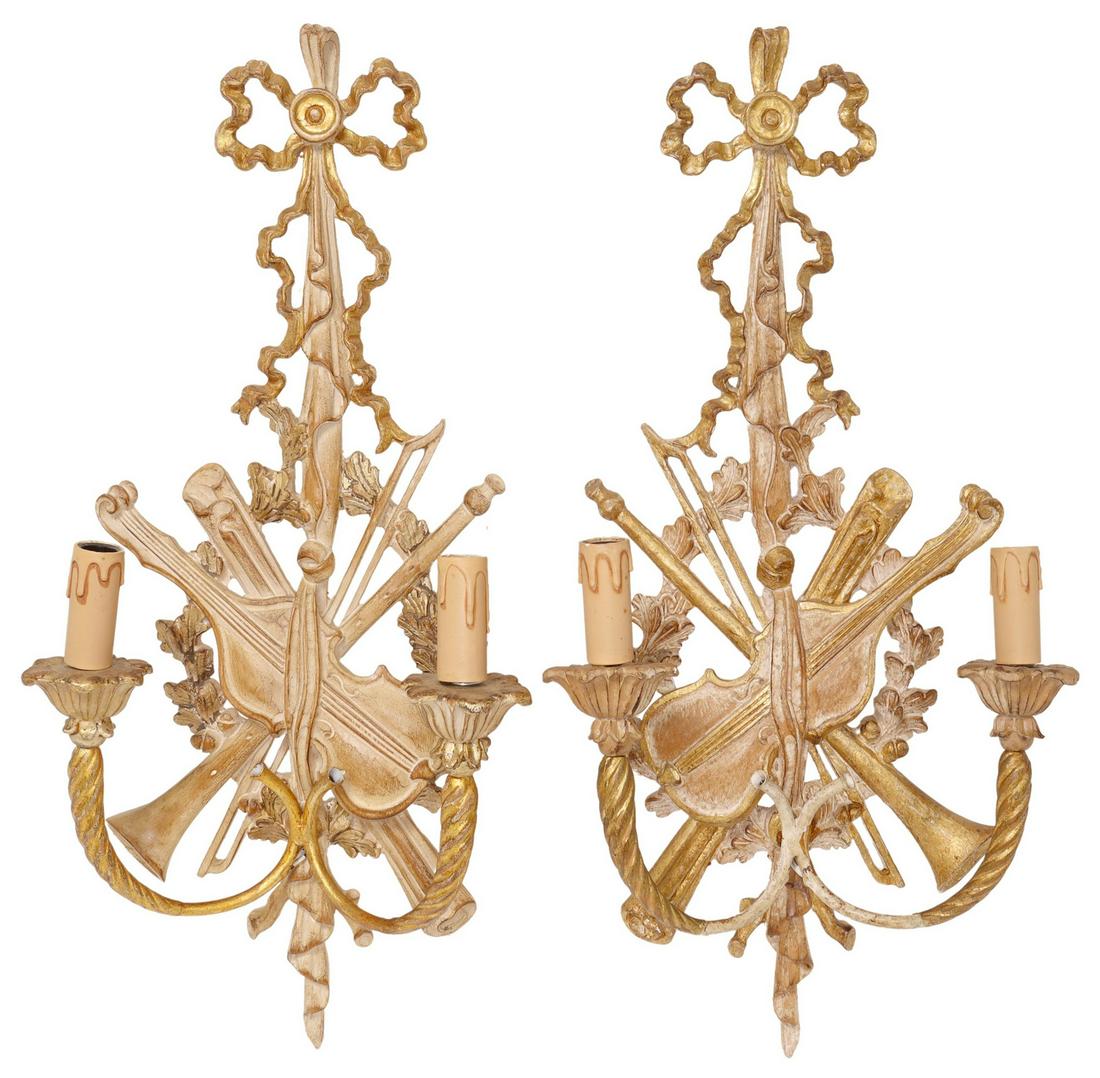 (2) FRENCH LOUIS XVI STYLE GILT INSTRUMENT SCONCES: (pair) French Louis XVI style gilt painted wood wall sconces, 20th c., ribbon back plate, over carved musical instruments, issuing floral bobeches, in need of wiring, approx 24.75"h, 11.5"w, 4"d, 3.25