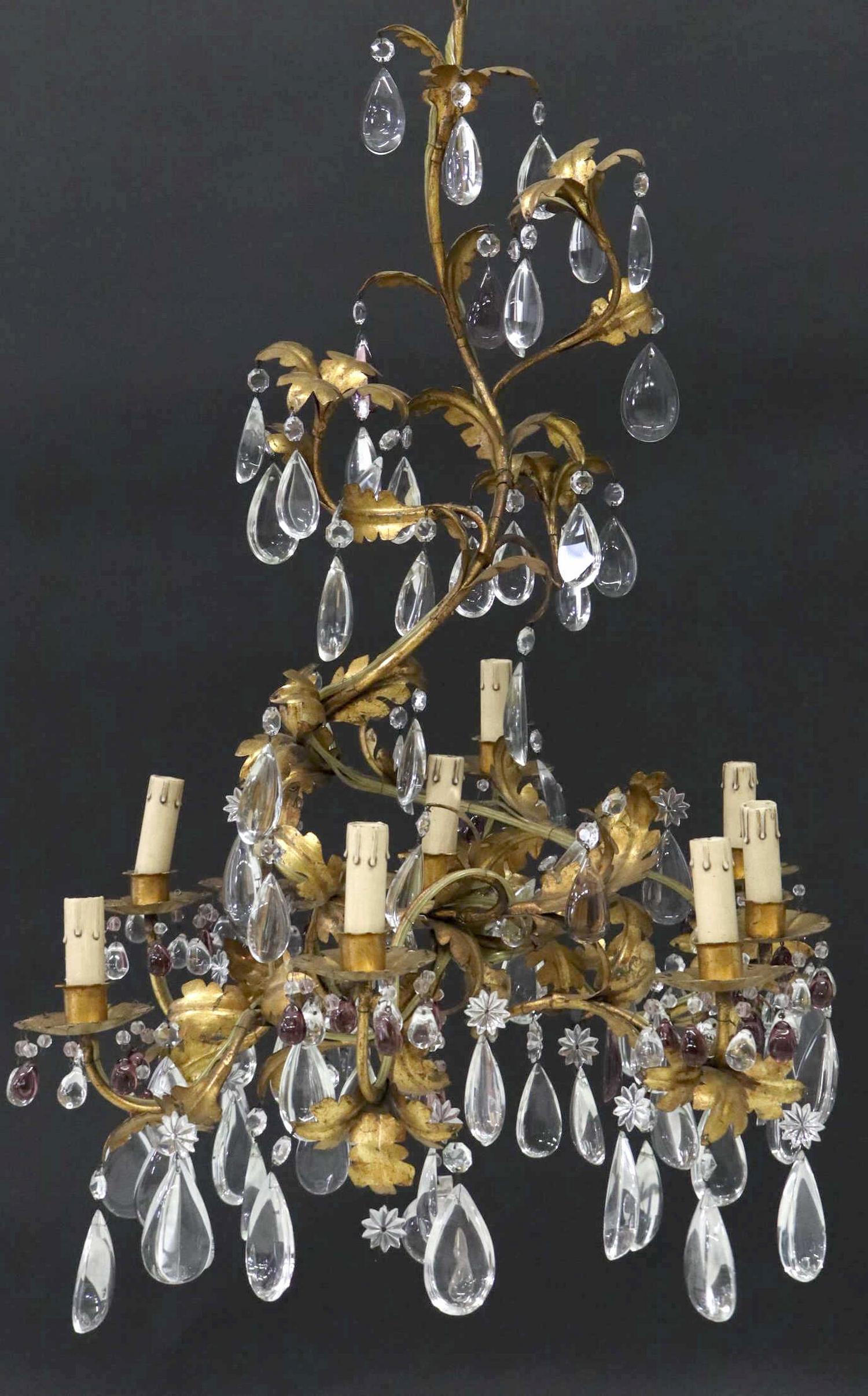 FRENCH GILT METAL & CRYSTAL NINE-LIGHT CHANDELIER: French gilt metal and crystal nine-light chandelier, 20th c., trailing foliate standard, issuing floral bobeches, the whole hung with colorless and amethyst color crystal prisms, in need of wiring, ap