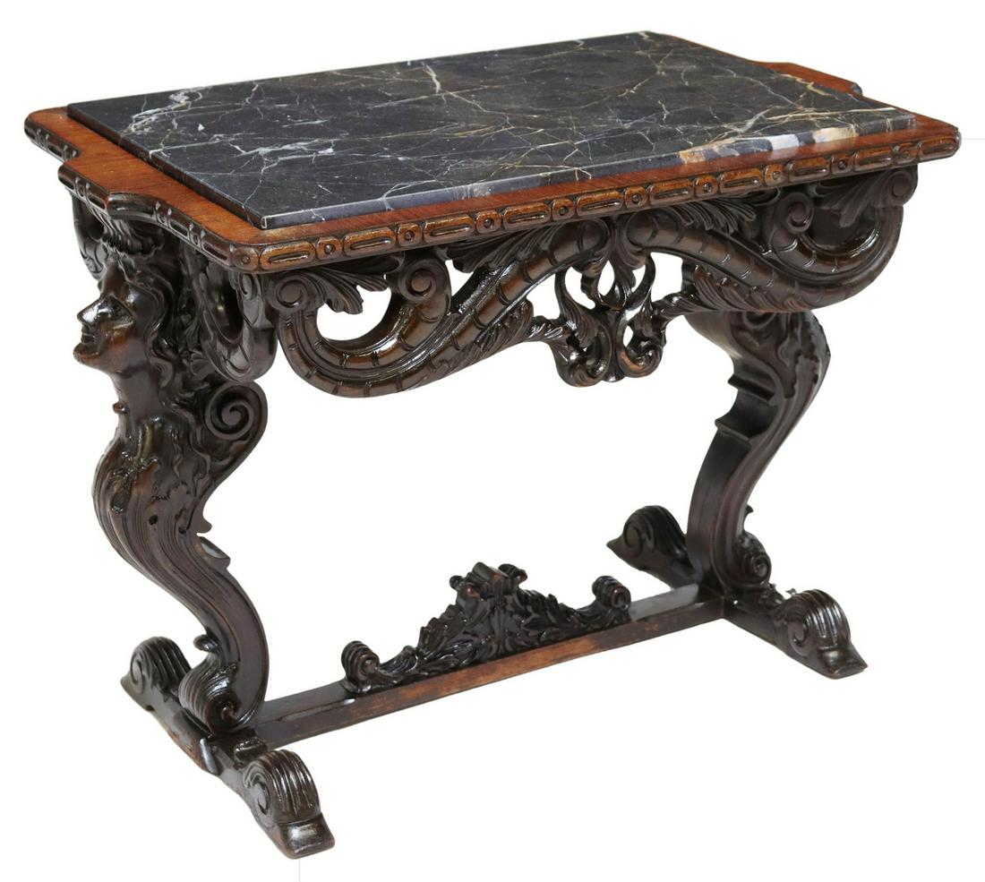 RENAISSANCE REVIVAL FIGURAL MARBLE-TOP TABLE: Italian Renaissance Revival occasional table, early 20th c., inset marble top, over scrolling foliate carved apron, rising on caryatid side supports, ending on stretcher-joined bridge feet, approx 21.