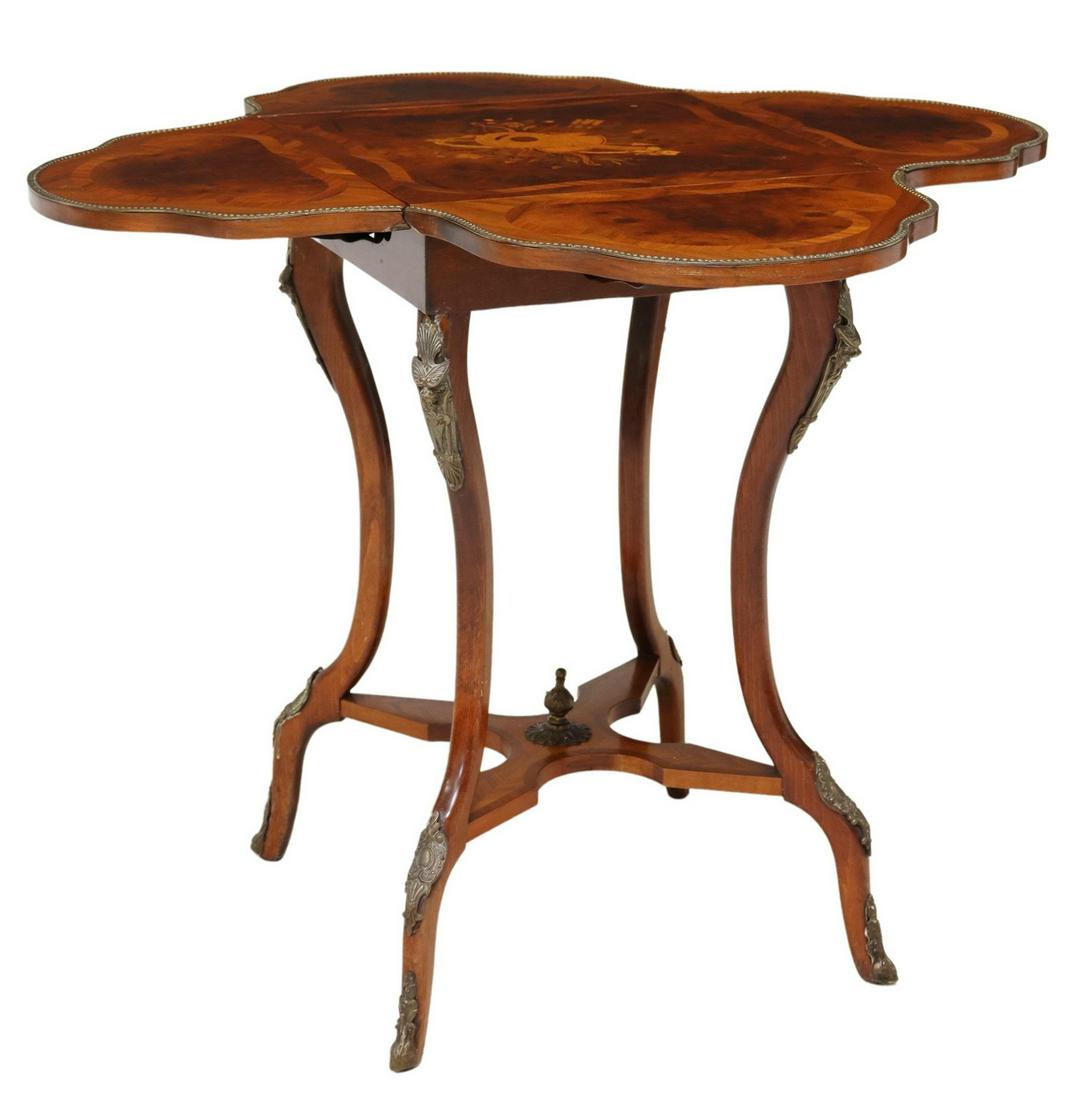 NAPOLEON III STYLE MARQUETRY DROP-LEAF TABLE: Napoleon III style drop-side table, 20th c., musical instrument marquetry to top, with four shaped folding sides, rising on stretcher-joined curved legs, ending in sabots, closed: approx 28.25"h, 17.7