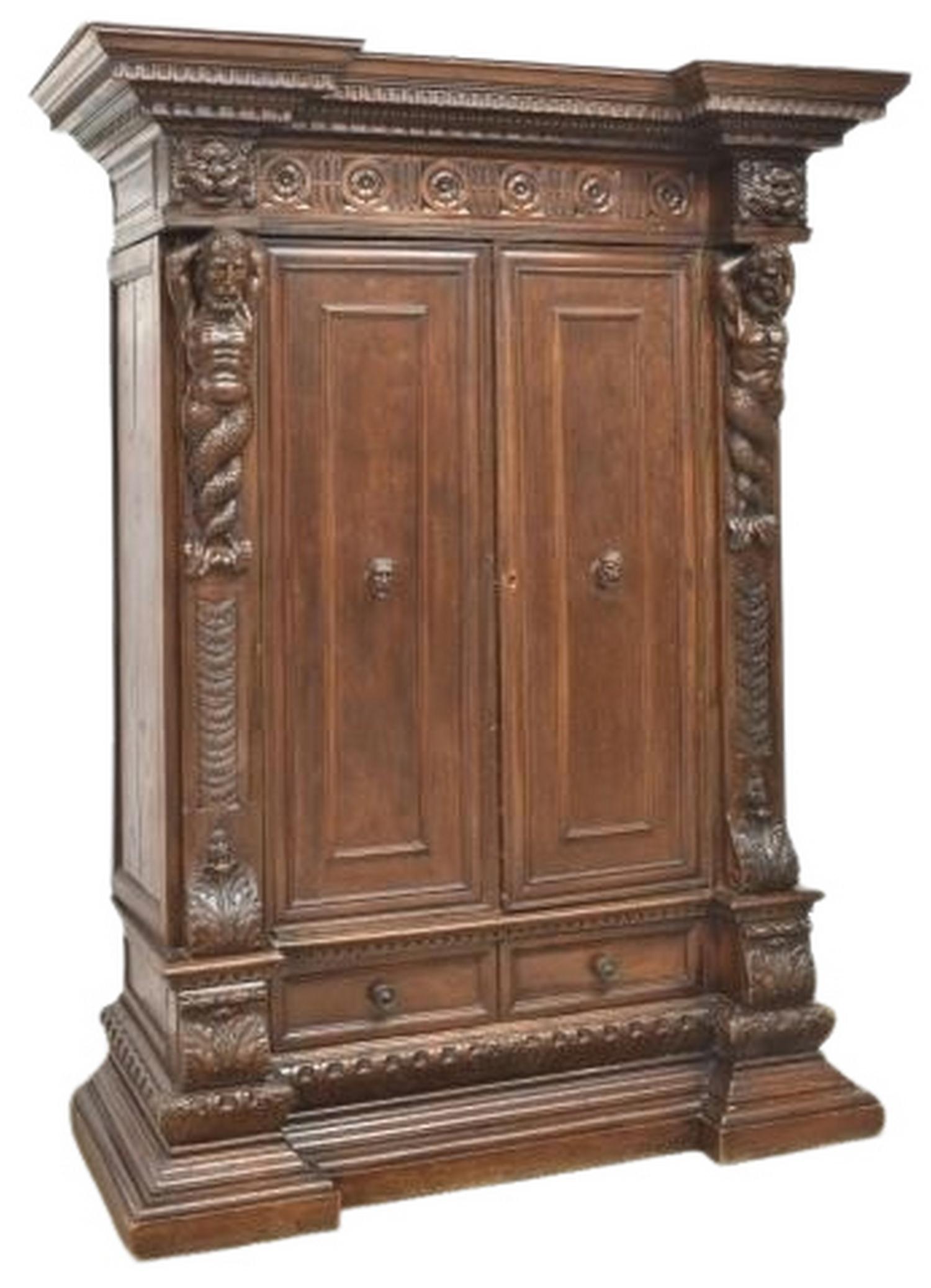 ITALIAN RENAISSANCE REVIVAL FIGURAL CARVED CABINET: Italian Renaissance Revival figural carved cabinet, 19th c., the stepped molded cornice over two doors with figural pulls, flanked by 23"h Glaucus figures, all rising the stepped base with drawers, ap