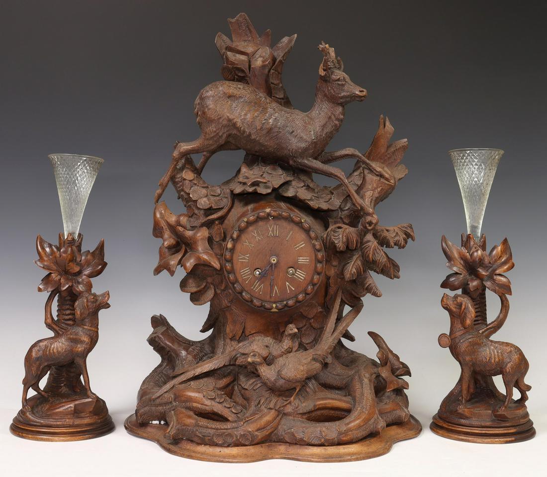 (3) BLACK FOREST STYLE MANTEL CLOCK & SPILL VASES: (lot of 3) Black Forest style carved mantel clock and garnitures, including: (1) shelf clock, leaping deer over foliage, pheasants, dial with gilt incised Roman numeral hour markers, time-and-strike m