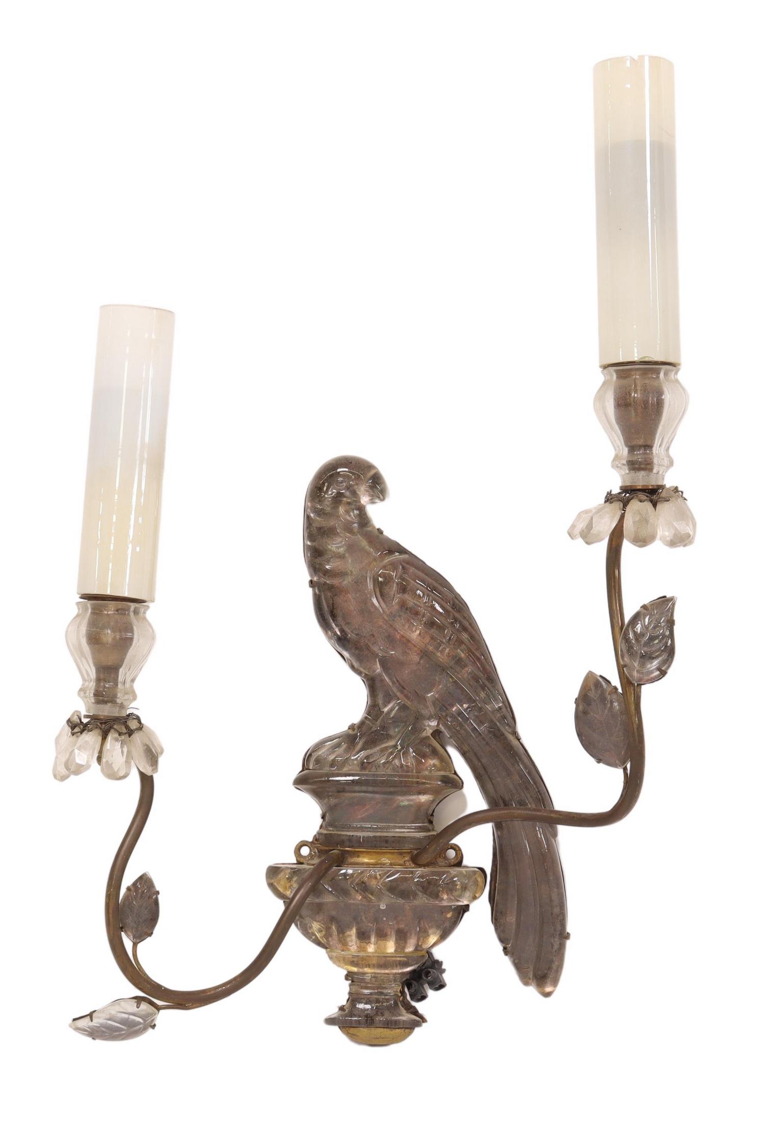 MAISON BAGUES (ATTRIB) CRYSTAL PERROQUET SCONCE: French two-light sconce, unmarked, attributed to Maison Bagues, 20th c., metal frame mounted with a crystal parrot perched on an urn, issuing scrolled arms with crystal leaves, terminating in two faux