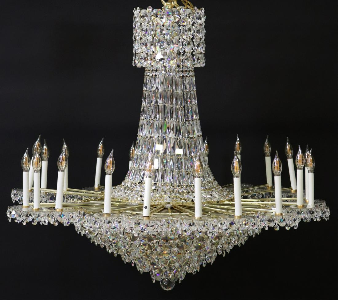 LARGE SCHONBEK TWO-TIER CRYSTAL 56-LT CHANDELIER: Monumental Schonbek gilt metal and crystal Empire style 56-light chandelier, late 20th c., having two-tier frame, issuing twenty-one tubular arms, ending in scalloped bobeches and faux candles, hung w