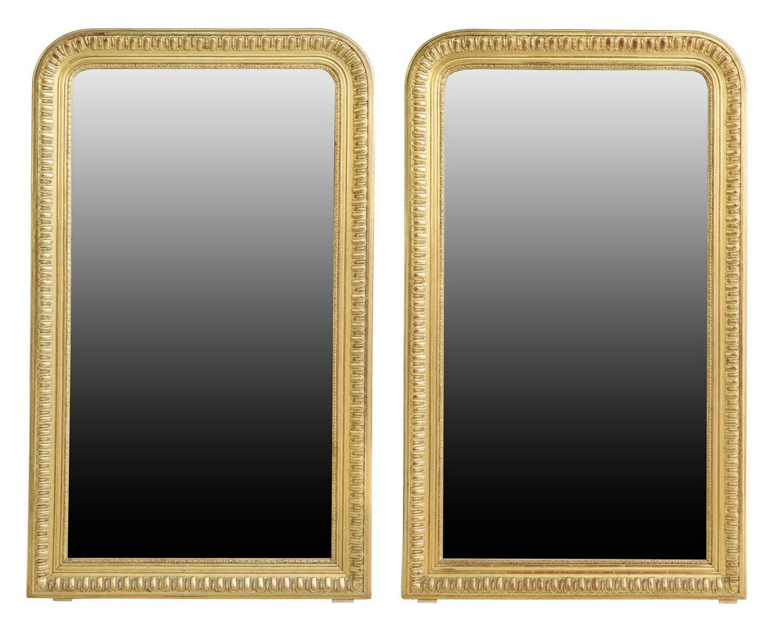 (2) FRENCH LOUIS PHILIPPE PERIOD GILTWOOD MIRRORS: (pair) French Louis Philippe period giltwood wall mirrors, mid 19th c., each having arched frame with molded trim, encasing flat mirror plate, approx 67"h, 39"w; 170lbs total Start Price: $1000.00