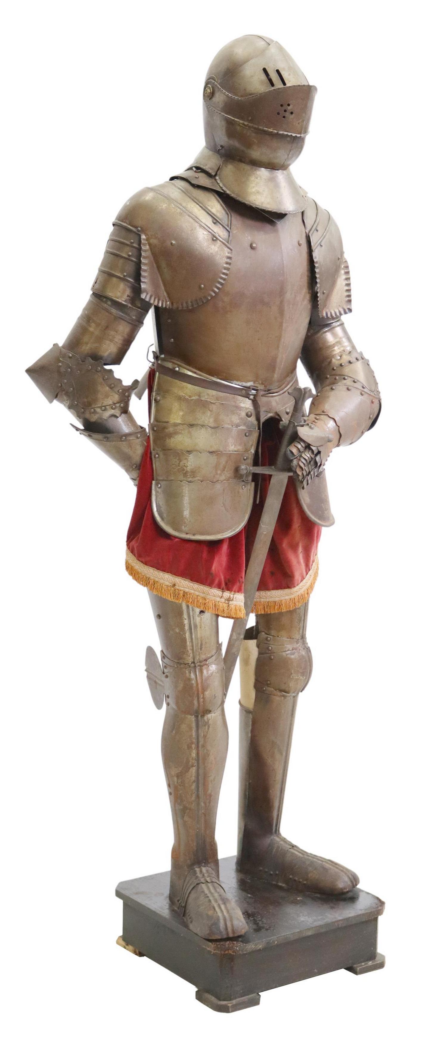 LIFE-SIZE REPLICA METAL KNIGHT'S SUIT OF ARMOR: Life-size replica metal suit of plate armor, with sword and velvet accents, rising on wood plinth, approx 77"h, 35"w, 18.25"d Start Price: $600.00
