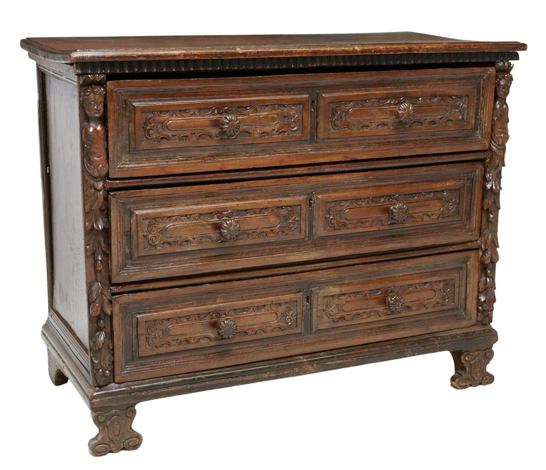 NORTHERN ITALIAN BAMBOCCIO COMMODE, 18TH C.: Northern Italian Baroque walnut "cassettone a bambocci," 18th c., three drawers, figural carved posts, rising on volute feet, approx 37"h, 46.5"w, 21.5"d Start Price: $800.00