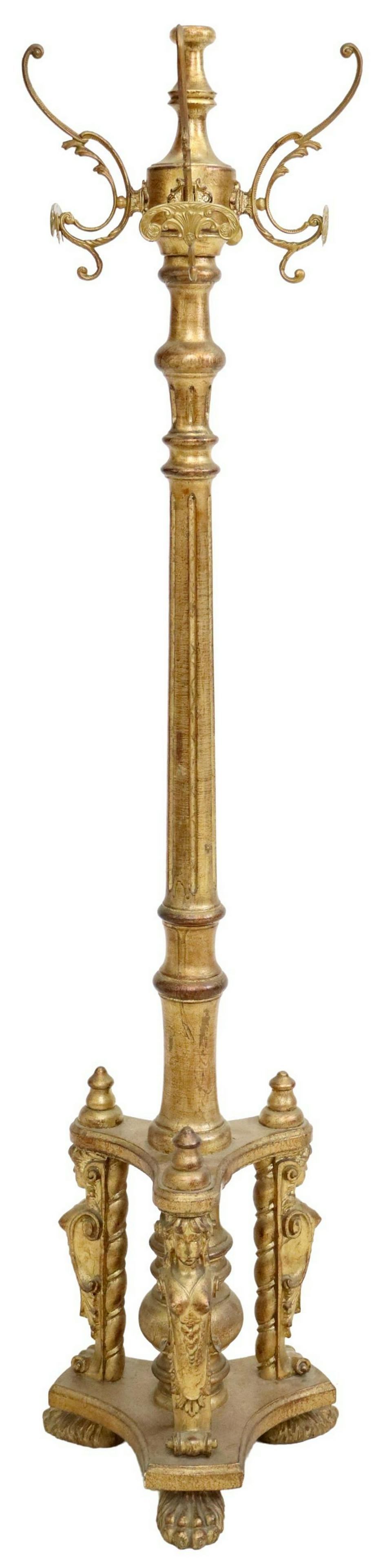 ITALIAN GILTWOOD FIGURAL STANDING HALL TREE: Italian giltwood standing hall tree, 20th c., having scrolling gilt metal arms, issuing four shell-form hooks, rising on turned and fluted standard, on figural tripartite base, ending on paw feet, app