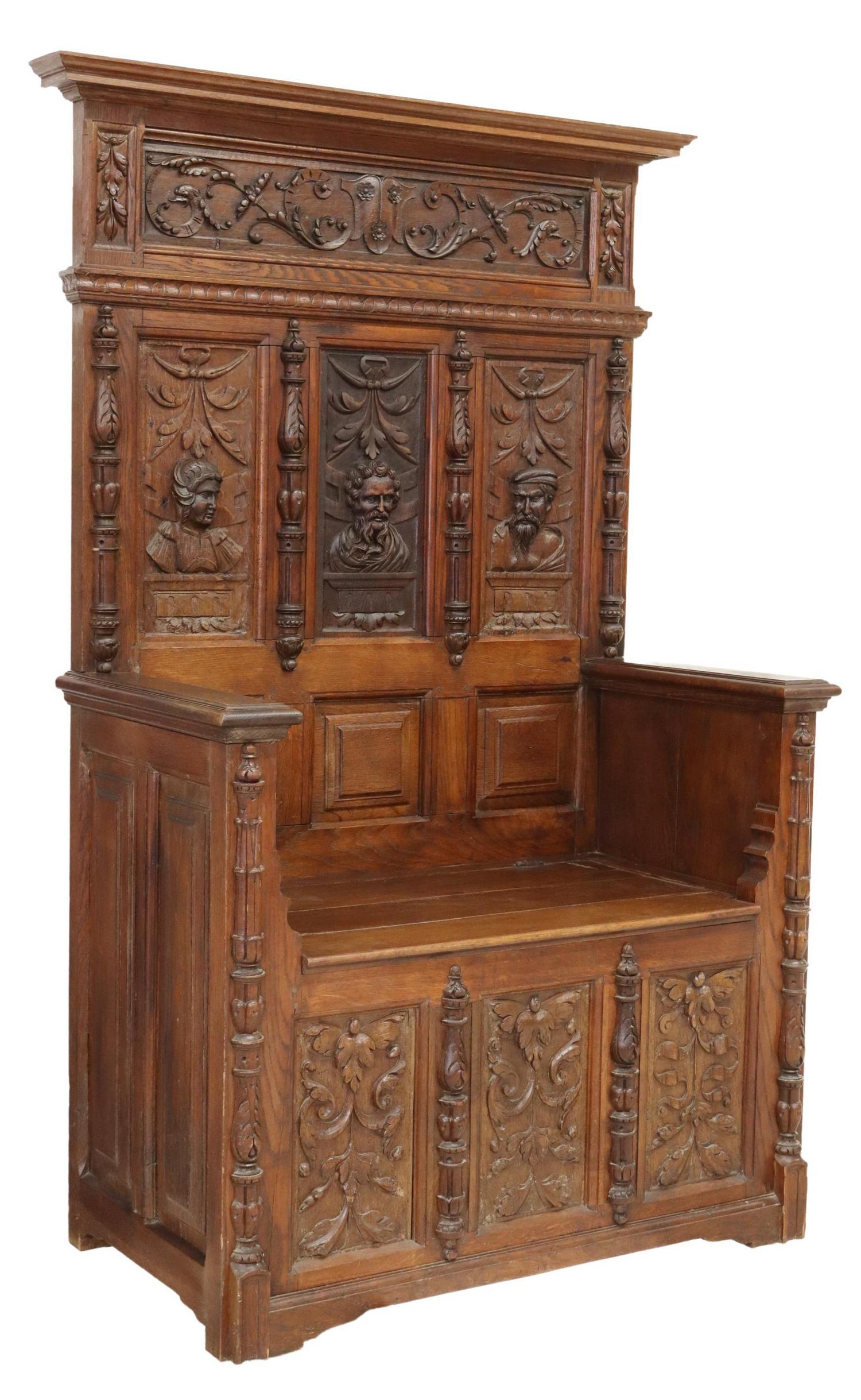 FRENCH HENRI II STYLE CARVED OAK HALL BENCH: French Henri II style oak hall bench, 19th c., having molded cornice, over figural carved back panels, hinged seat, opening to storage interior, rising on plinth base, restoration to seat top, approx 
