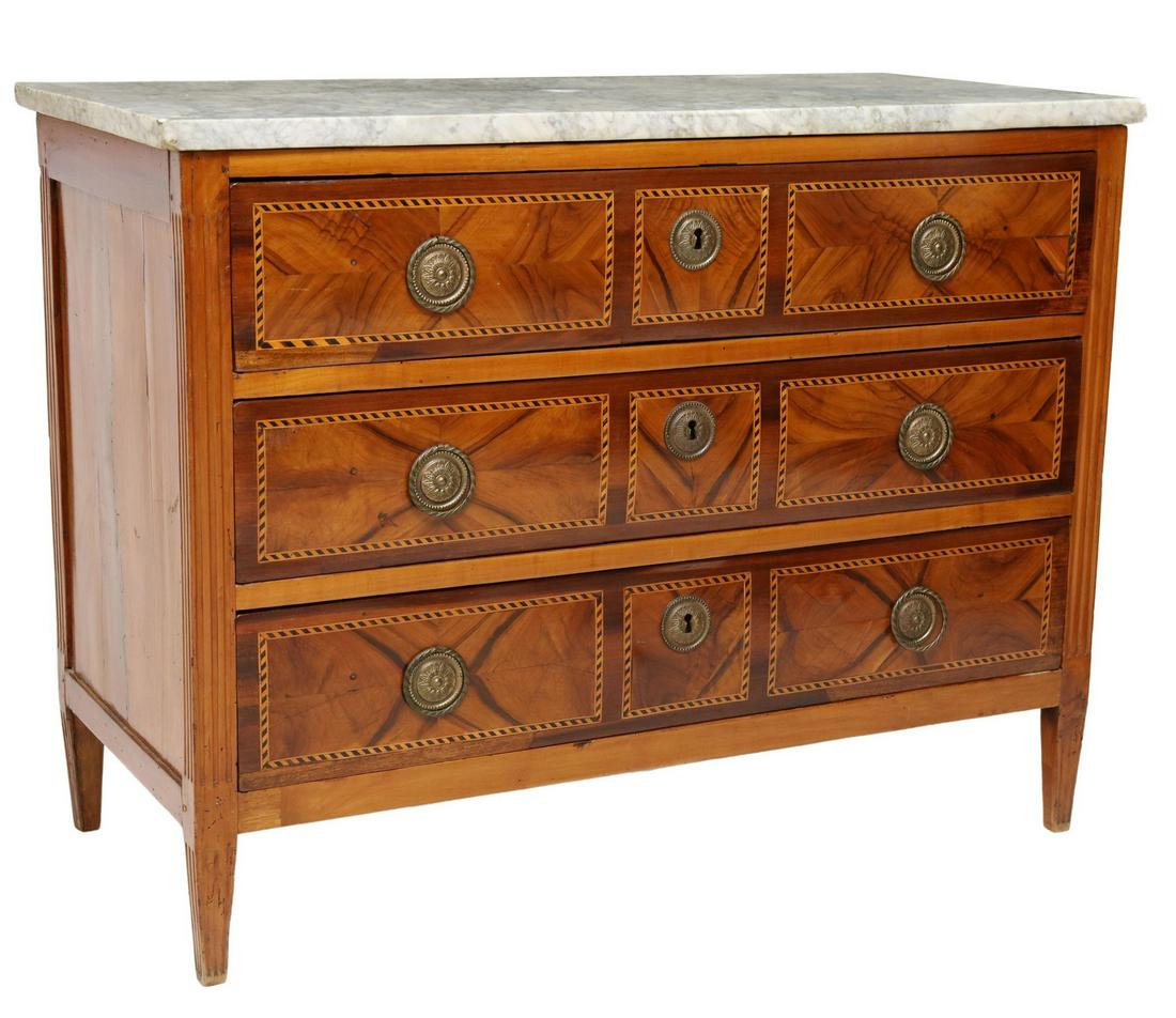 ITALIAN NEOCLASSICAL STYLE MARBLE-TOP COMMODE: Italian Neoclassical style marble-top commode, late 19th/ early 20th c., three drawers with two-tone parquetry banding, fluted corner posts, rising on tapering square legs, approx 34.5"h, 45.5"w, 21"d