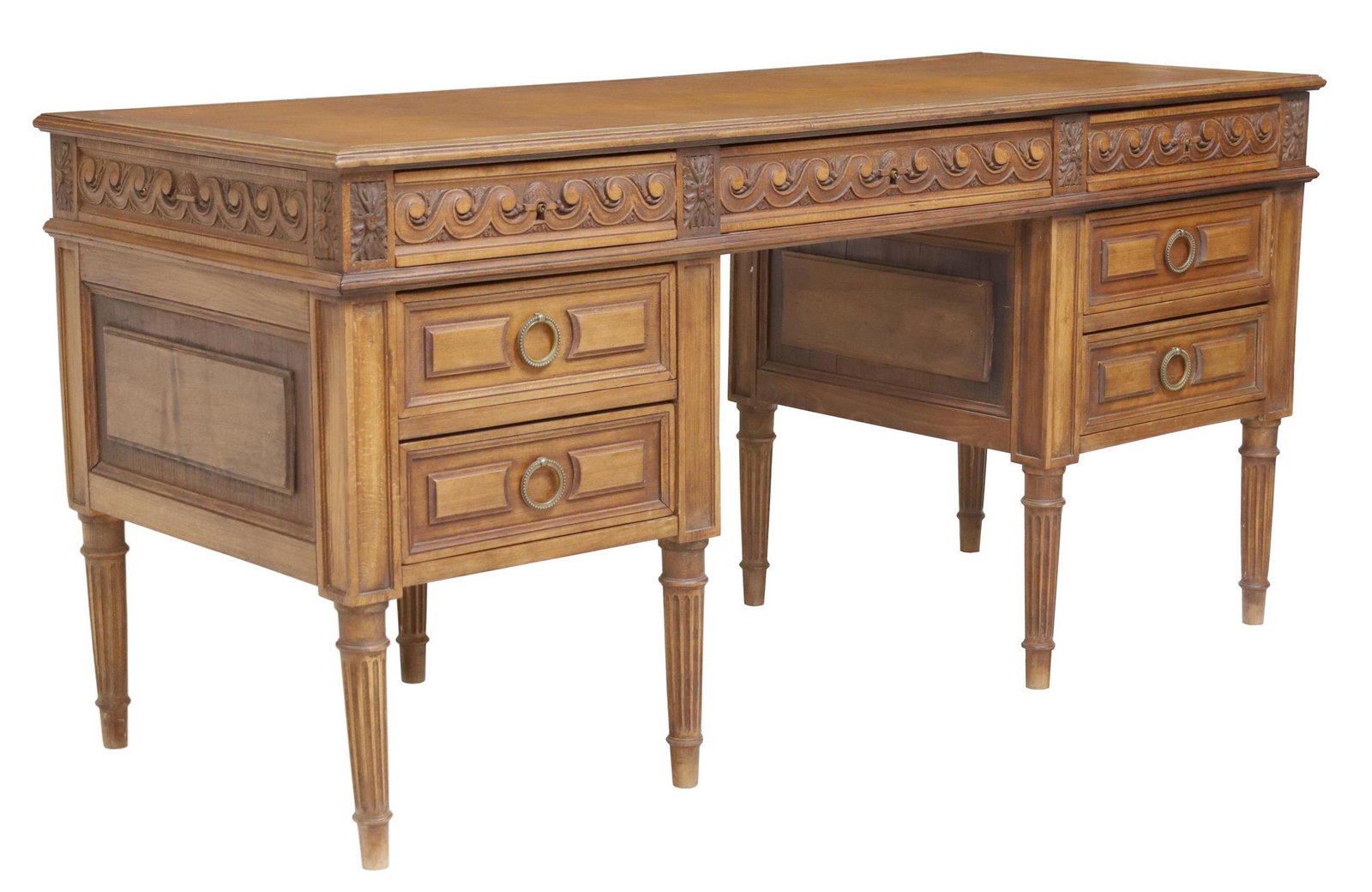 LOUIS XVI STYLE CARVED WRITING DESK: Louis XVI style writing desk, 20th c., inset writing surface with gilt key border, seven drawers, rising on tapering fluted legs, approx 30.75"h, 63"w, 25.5"d Start Price: $150.00