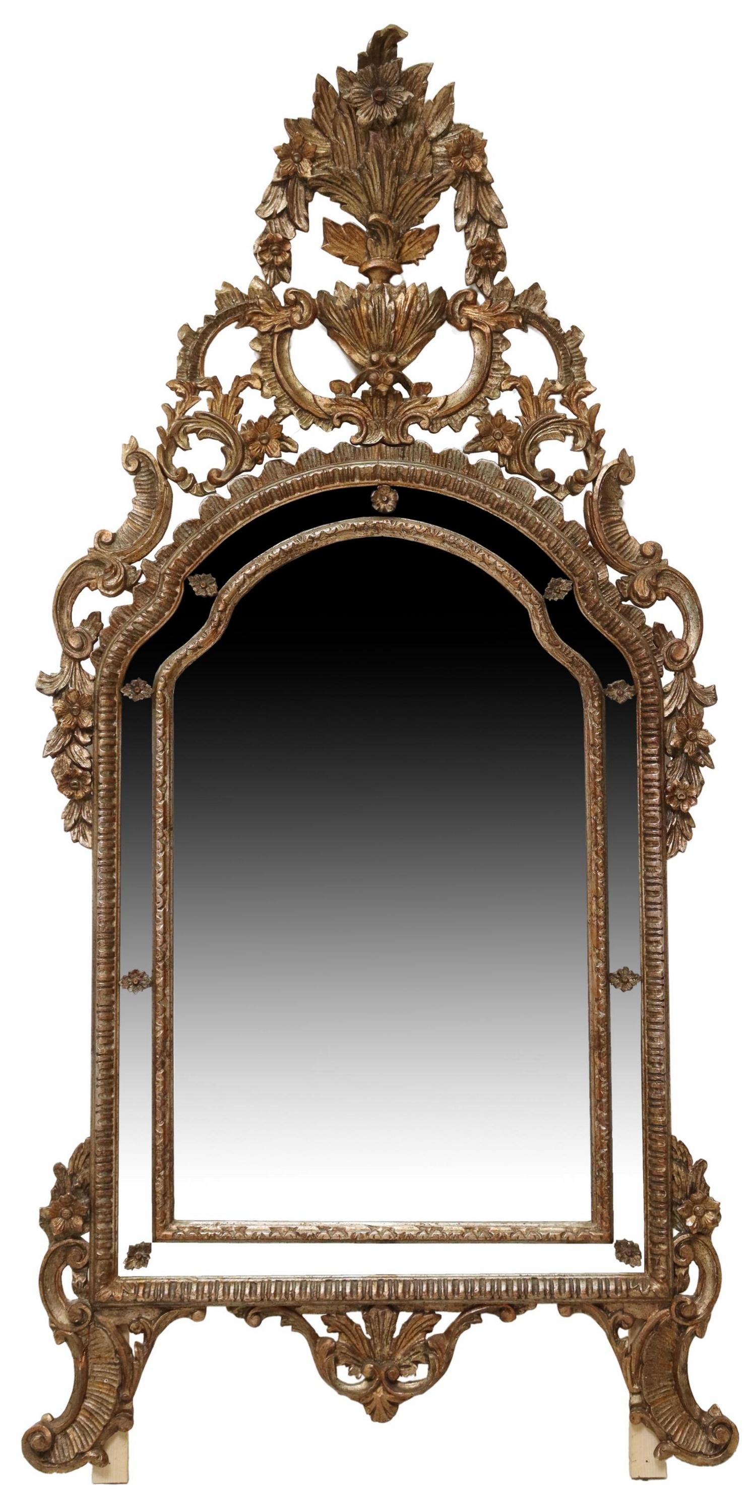 ITALIAN FLORENTINE GILTWOOD CUSHION WALL MIRROR: Italian Florentine giltwood cushion wall mirror, early 20th c., pierced crest with scrolled foliates and floral motifs, over shaped and molded cushion frame, encasing flat mirror plate, approx 74"h, 3